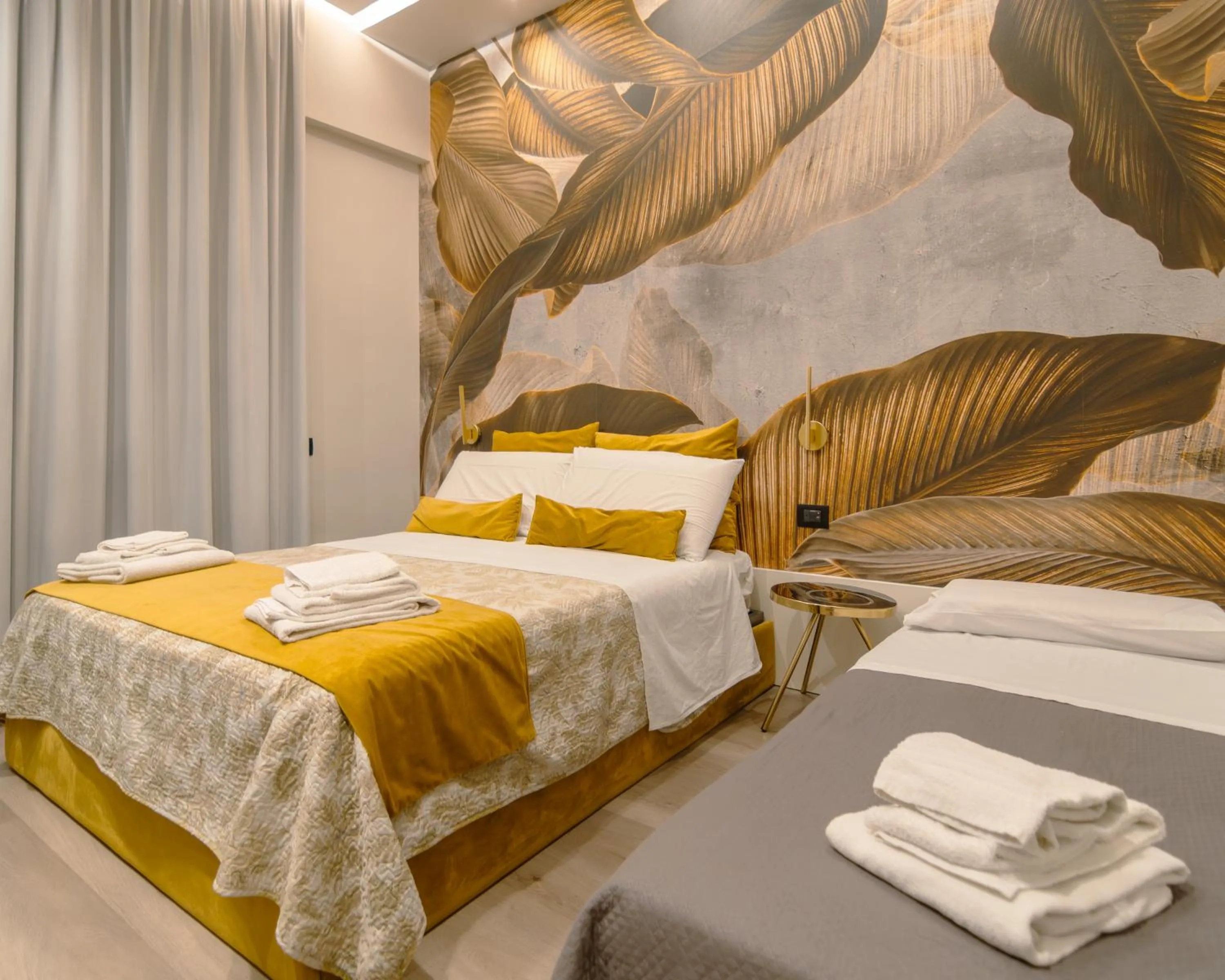 Bed in VESUVIANUS Rooms and More