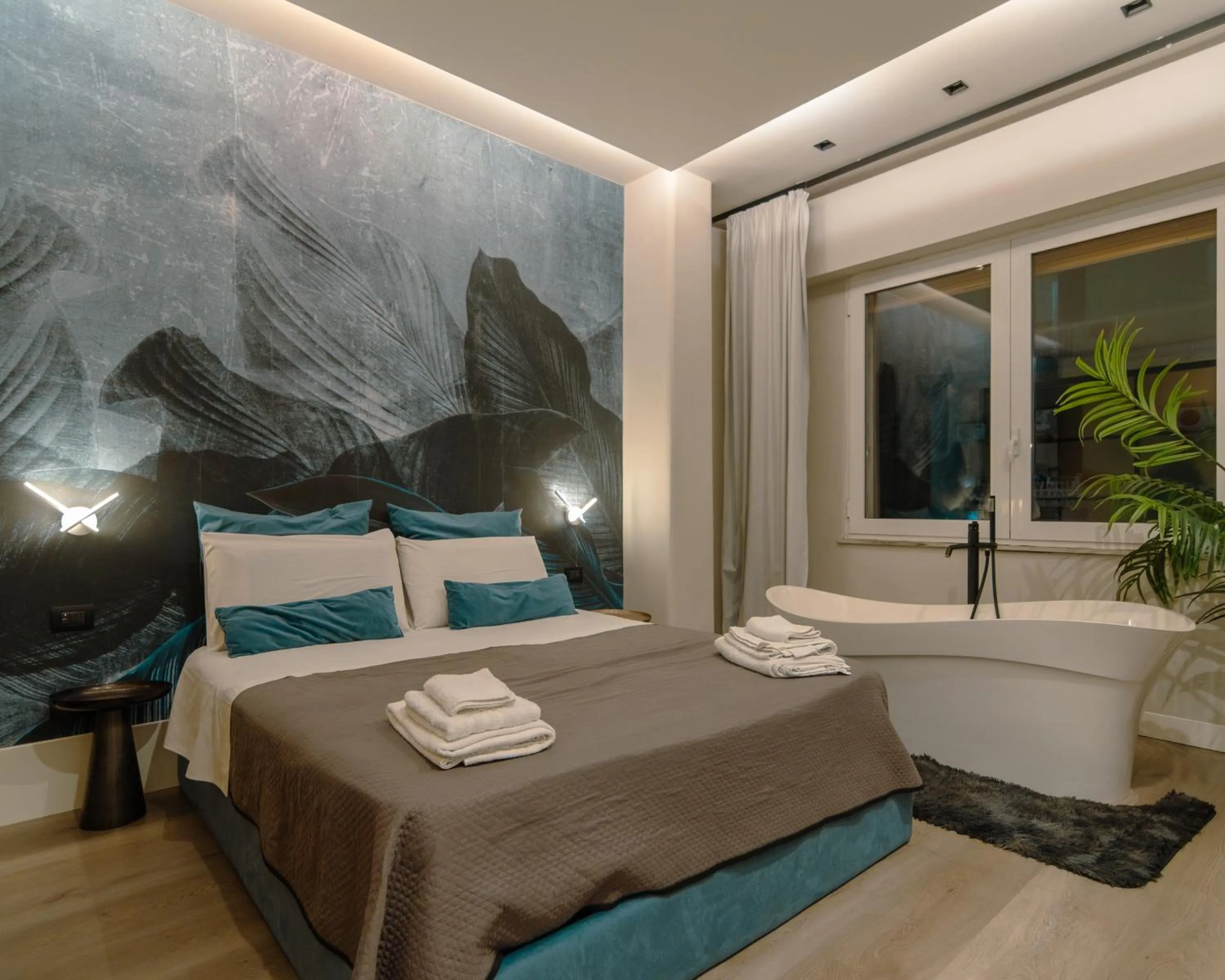 Bed in VESUVIANUS Rooms and More