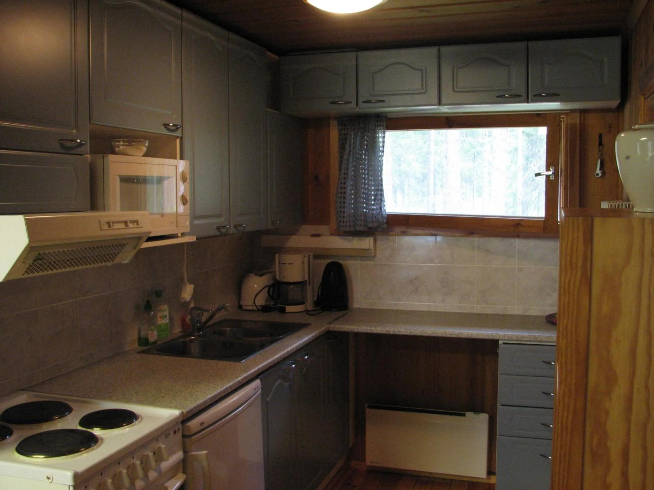 Kitchen or kitchenette in Ollilan Lomamajat