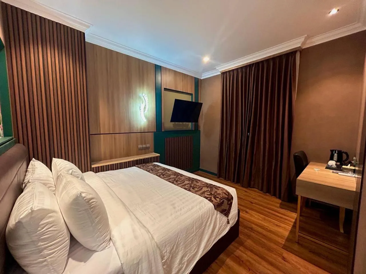 Bed in Bona Ventura Hotel & Skybar