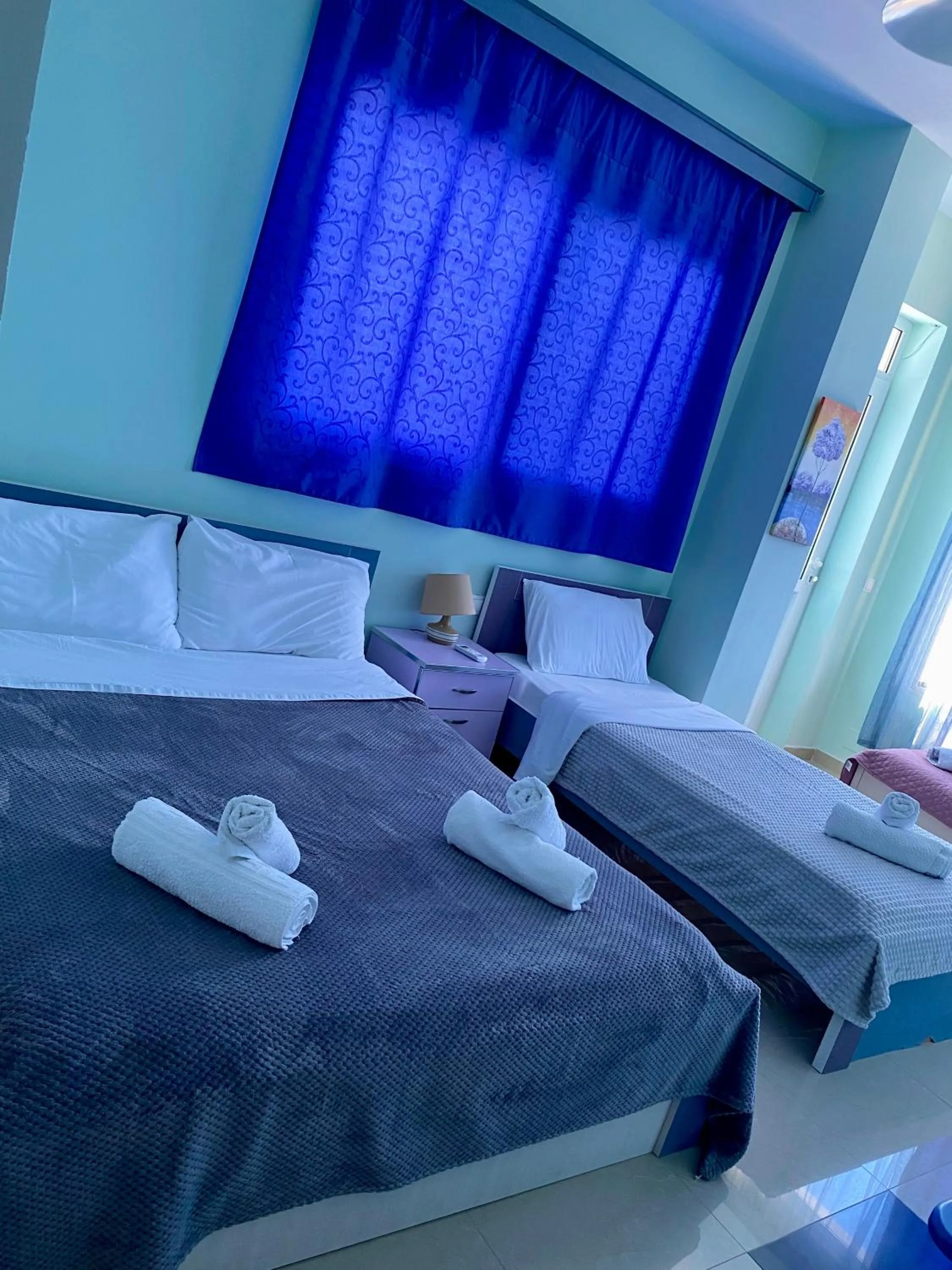 Bed in Kalemi's Beachside Hotel