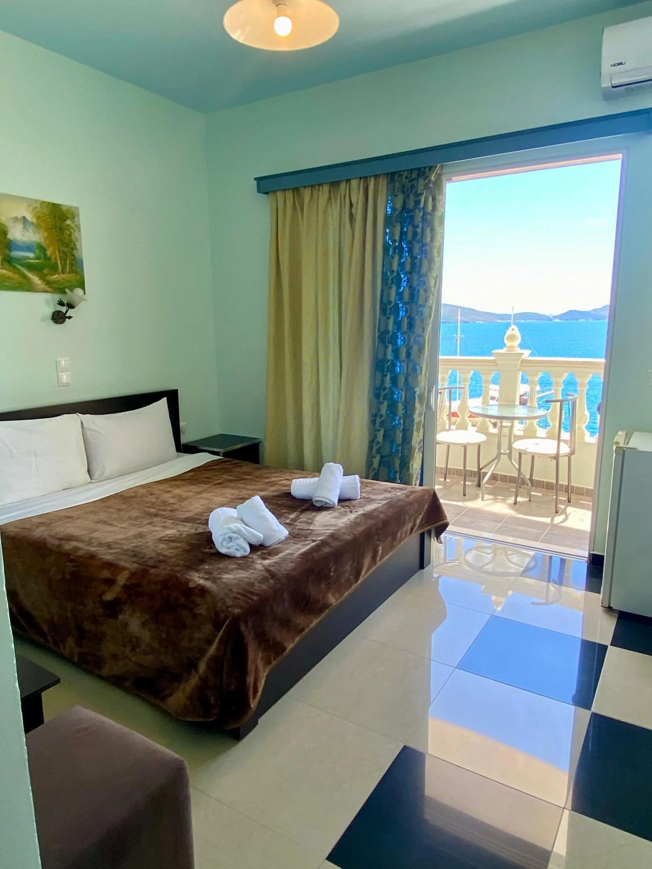 Bed in Kalemi's Beachside Hotel