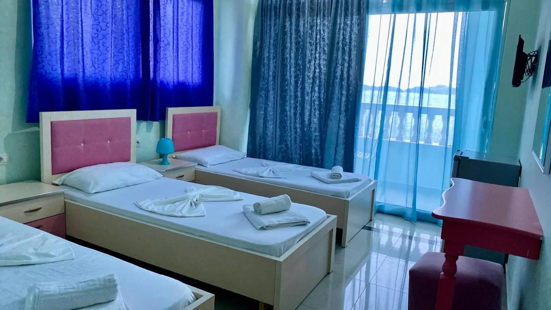 Bed in Kalemi's Beachside Hotel