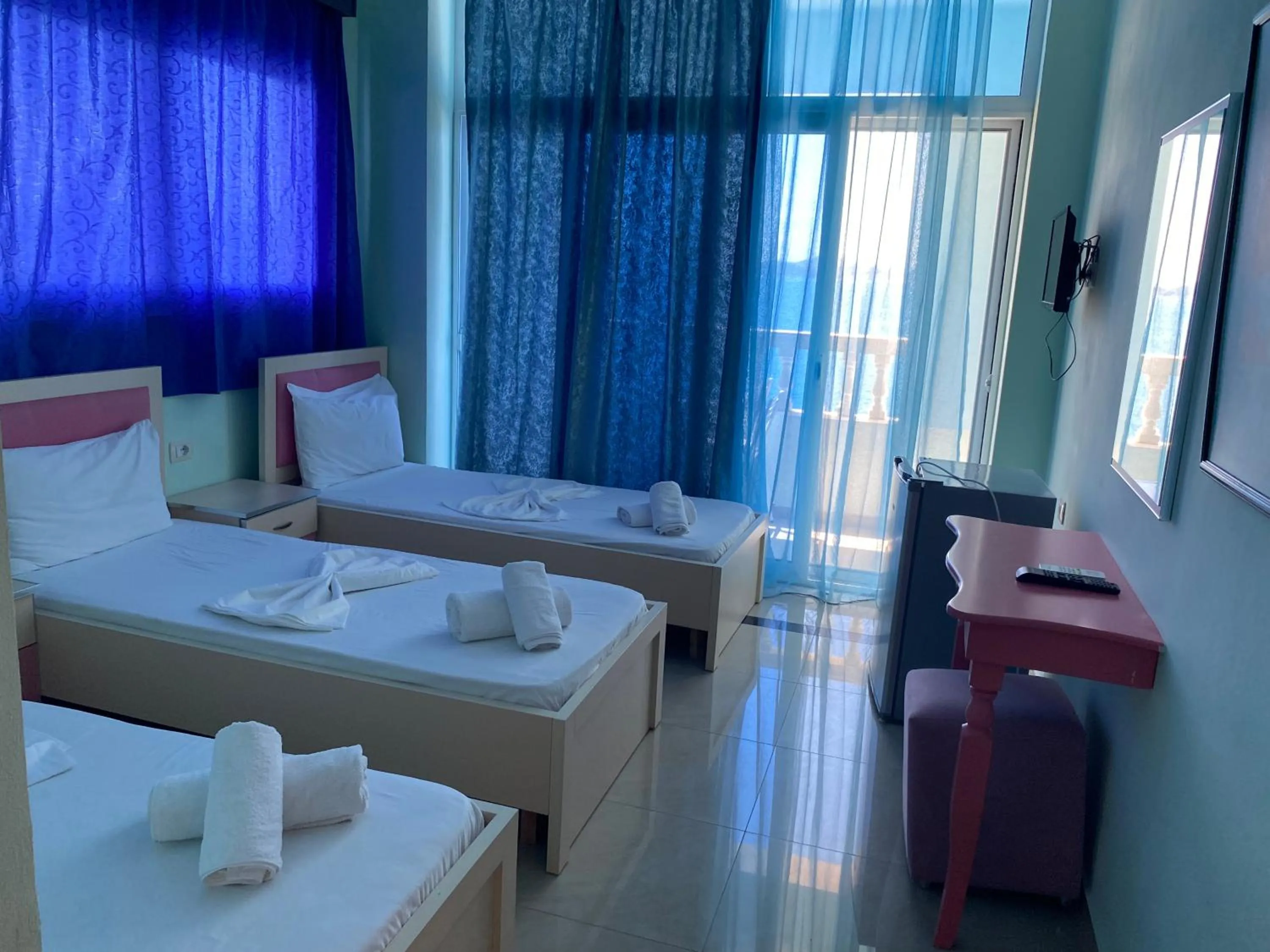 Bed in Kalemi's Beachside Hotel