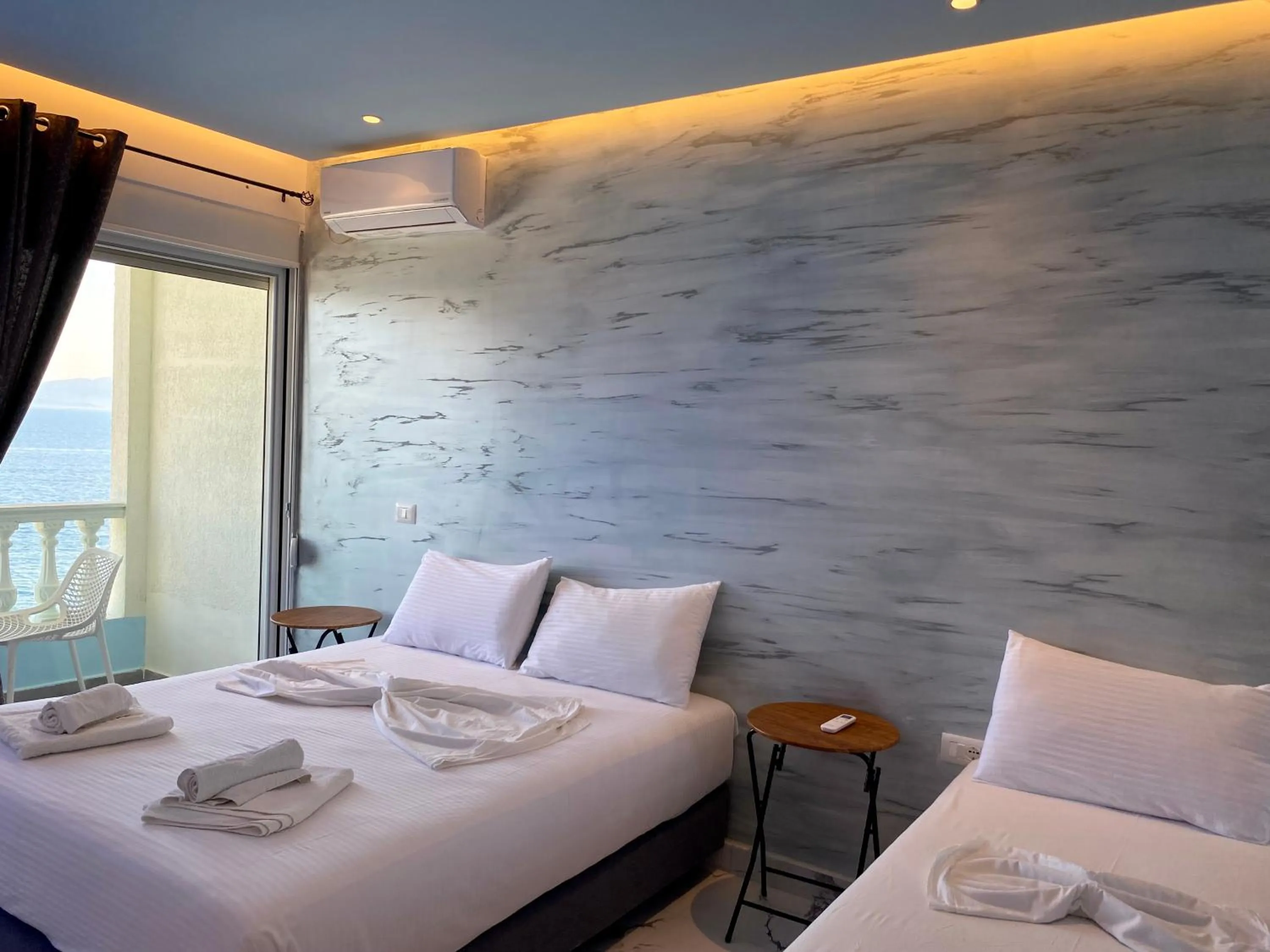 Bed in Kalemi's Beachside Hotel