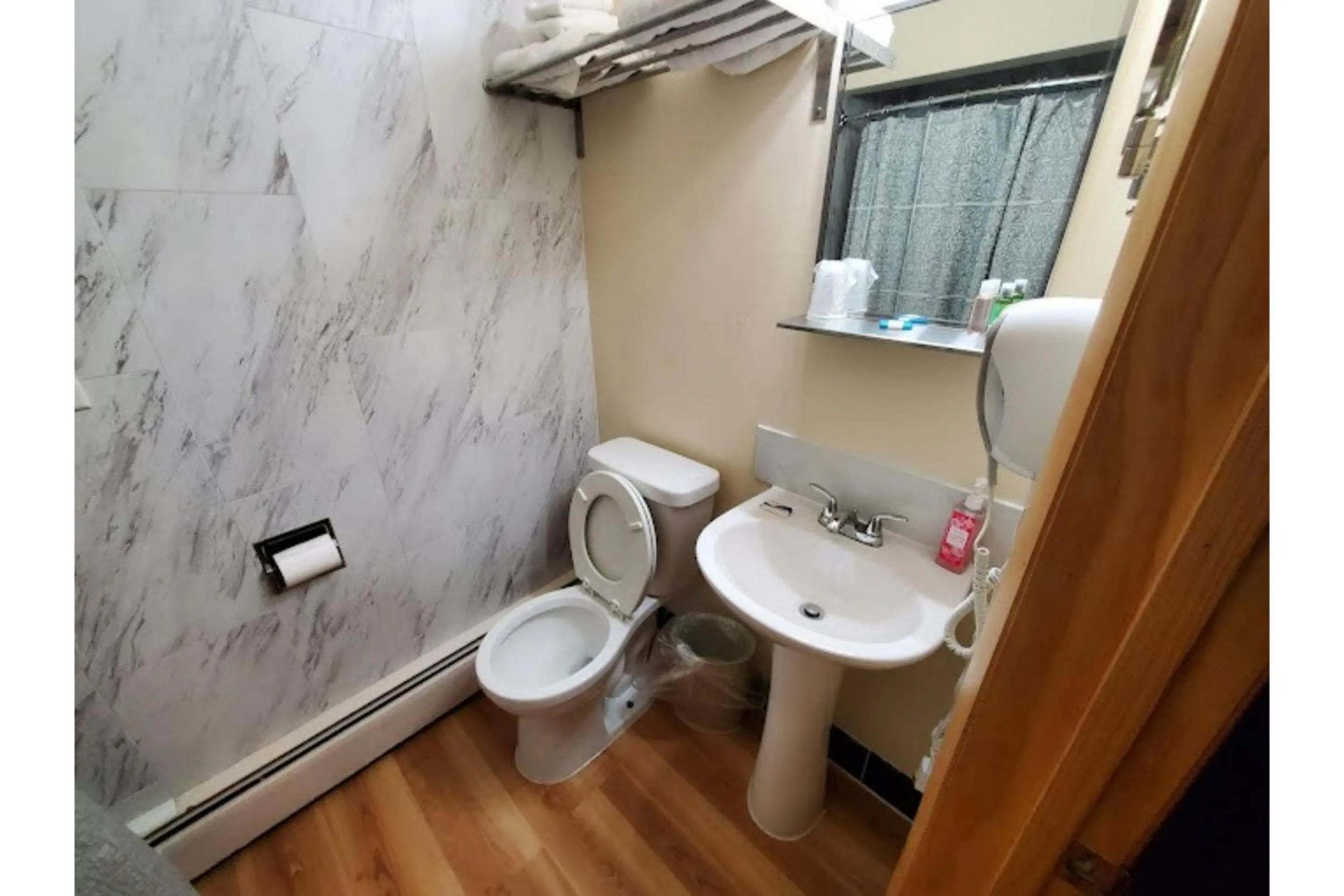 Bathroom in Wisconsin-Aire Motel By OYO Random Lake