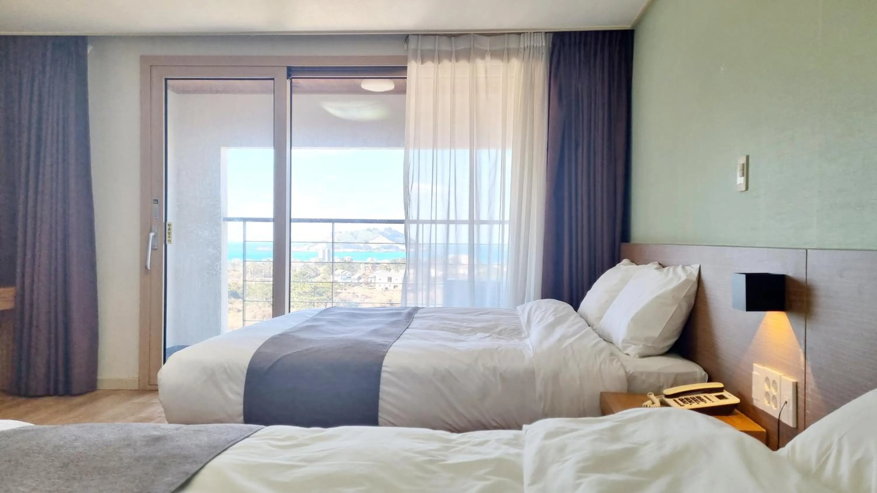 Bed in Hi Jeju Hotel