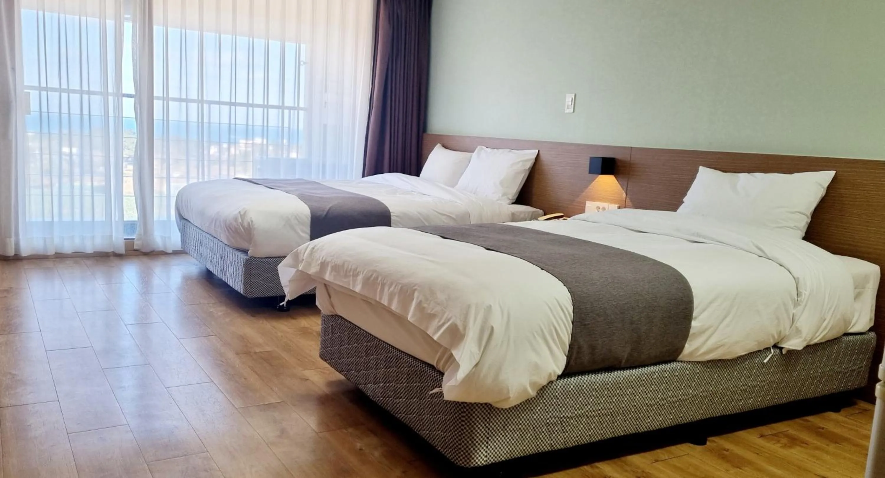 Bed in Hi Jeju Hotel