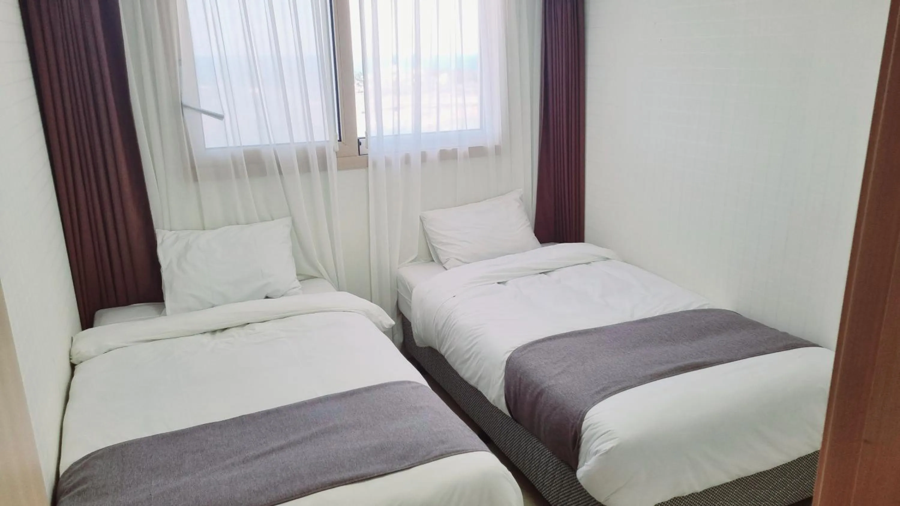 Bed in Hi Jeju Hotel