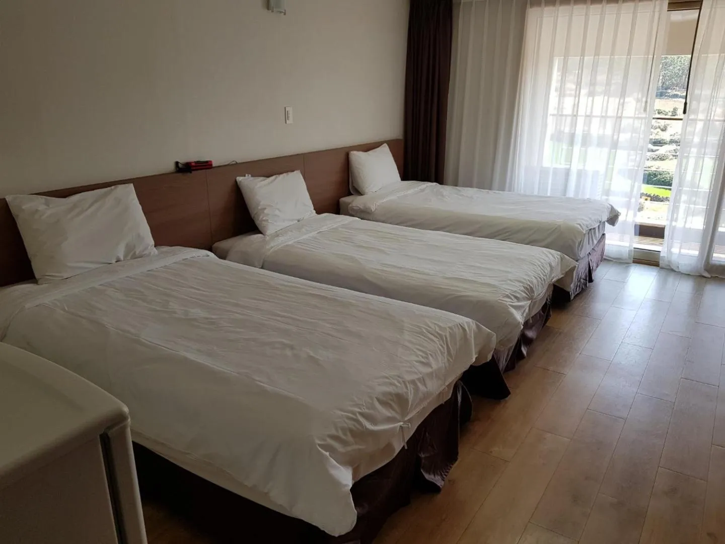 Bed in Hi Jeju Hotel