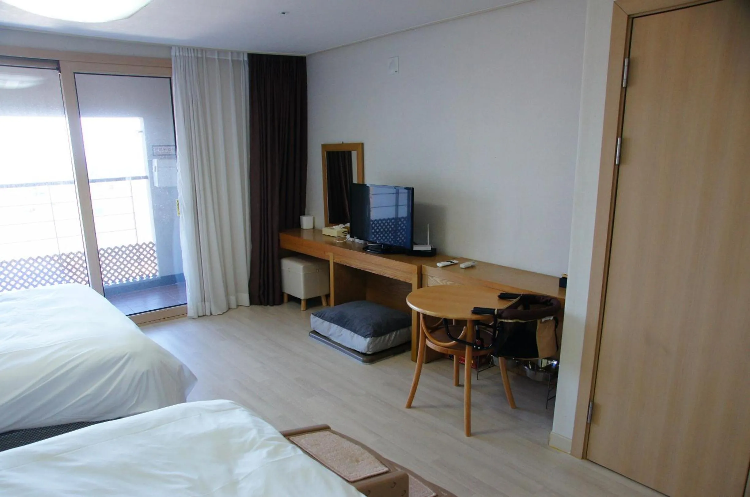 Bed in Hi Jeju Hotel