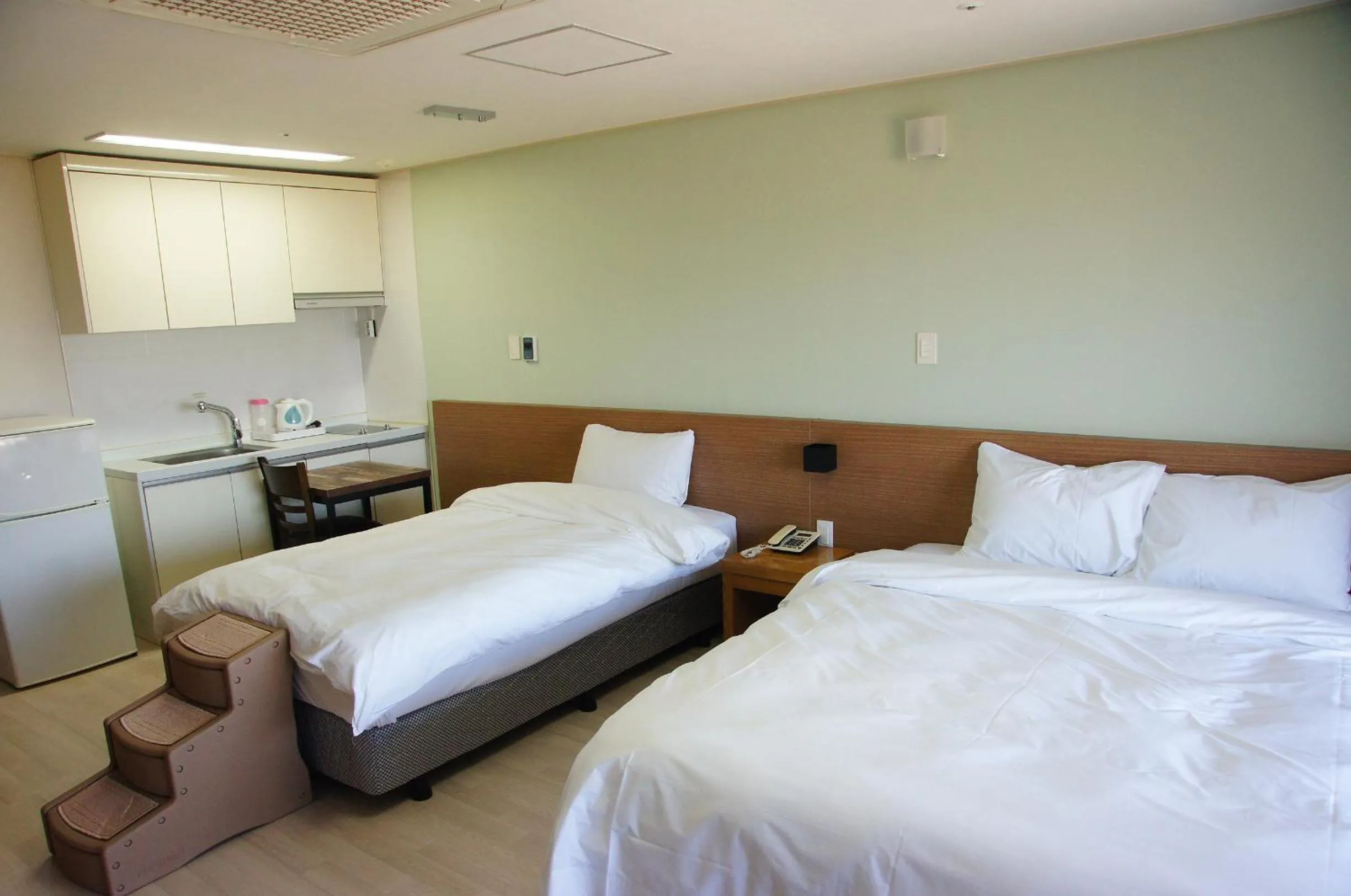 Bed in Hi Jeju Hotel