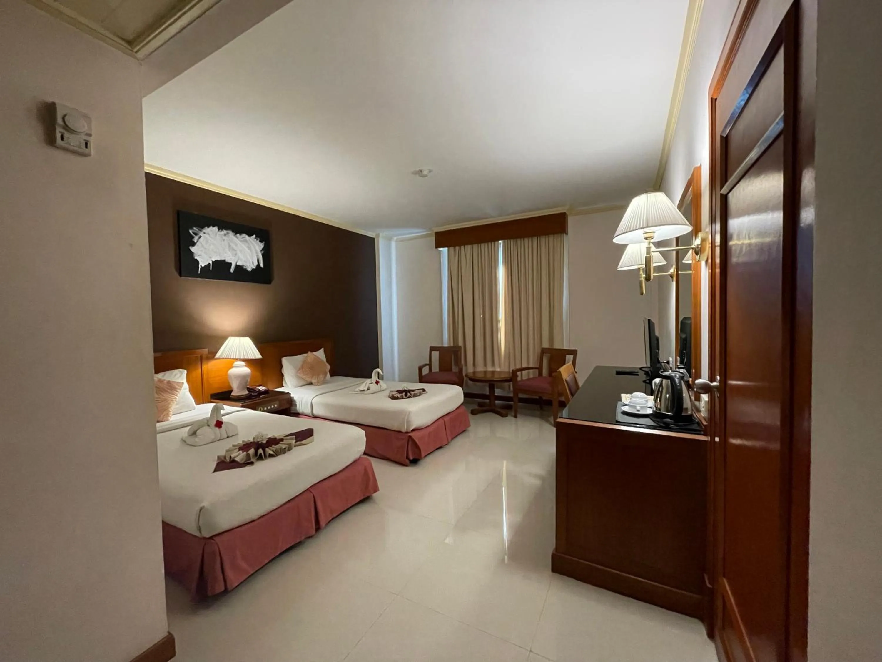 Bed in Songphanburi Hotel