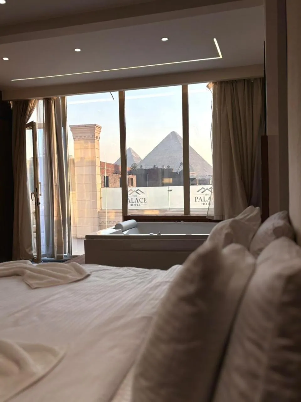 Bed in The Palace Pyramids View Hotel