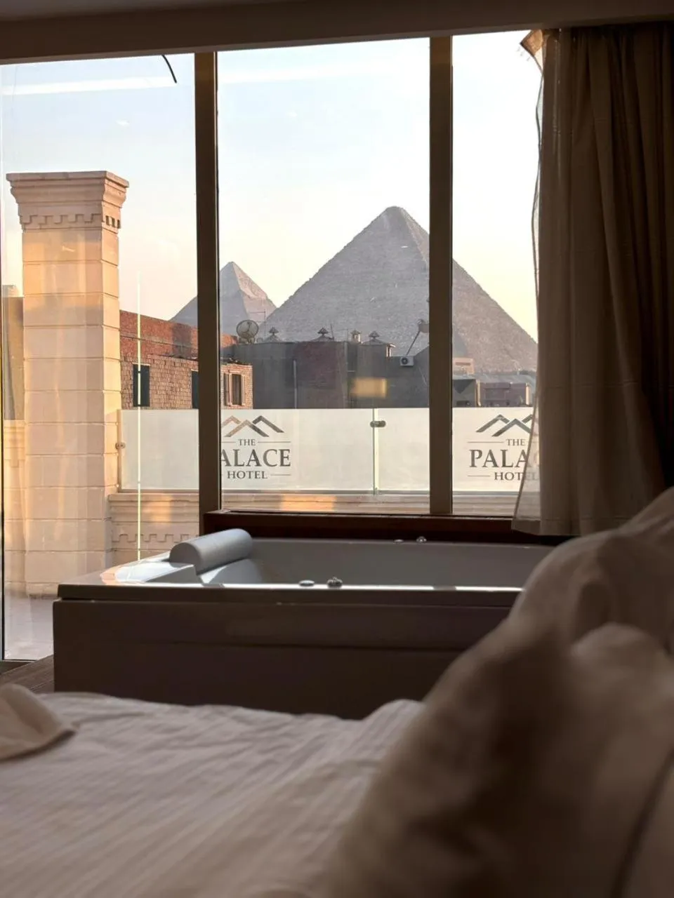 Bed in The Palace Pyramids View Hotel