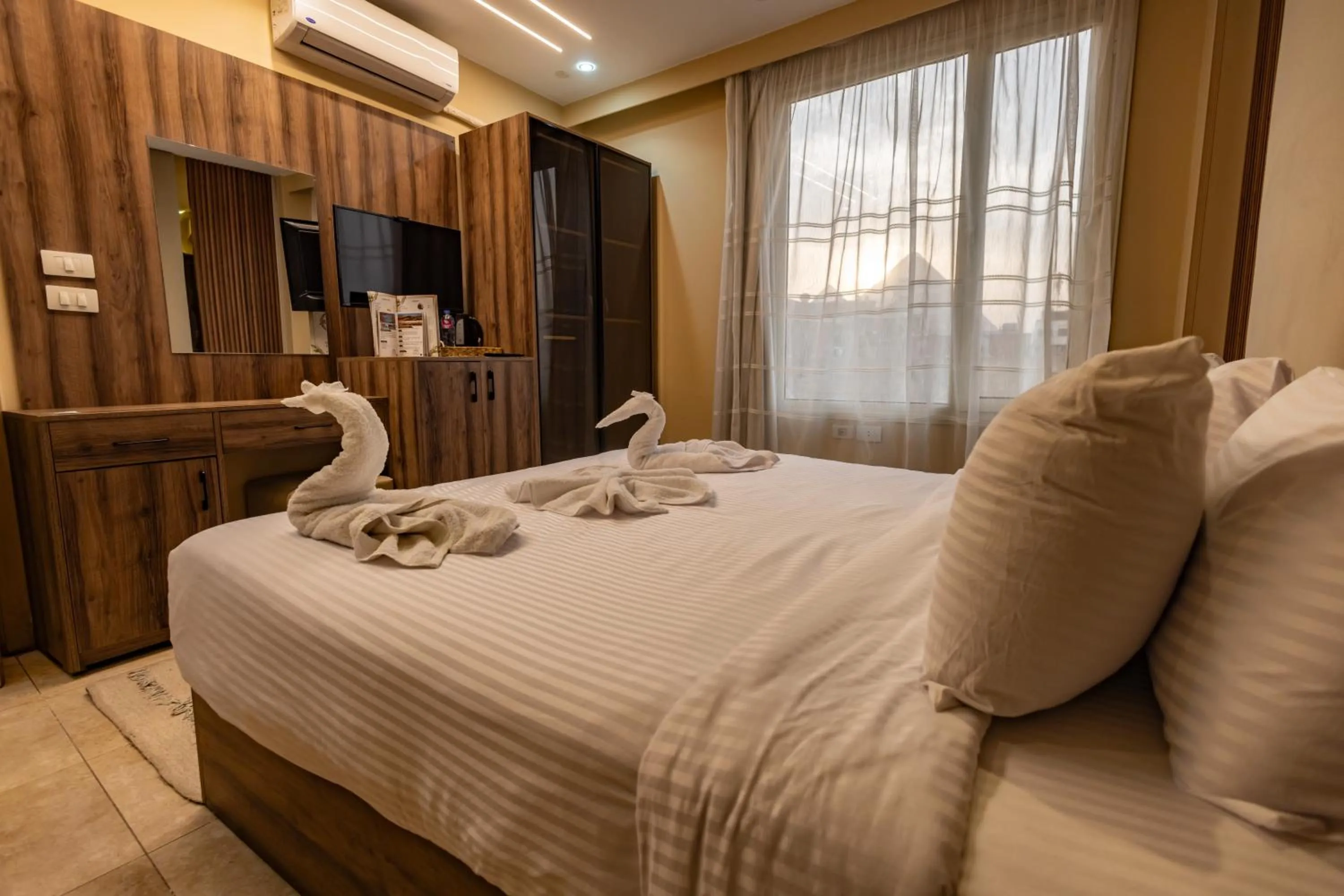 Bed in The Palace Pyramids View Hotel