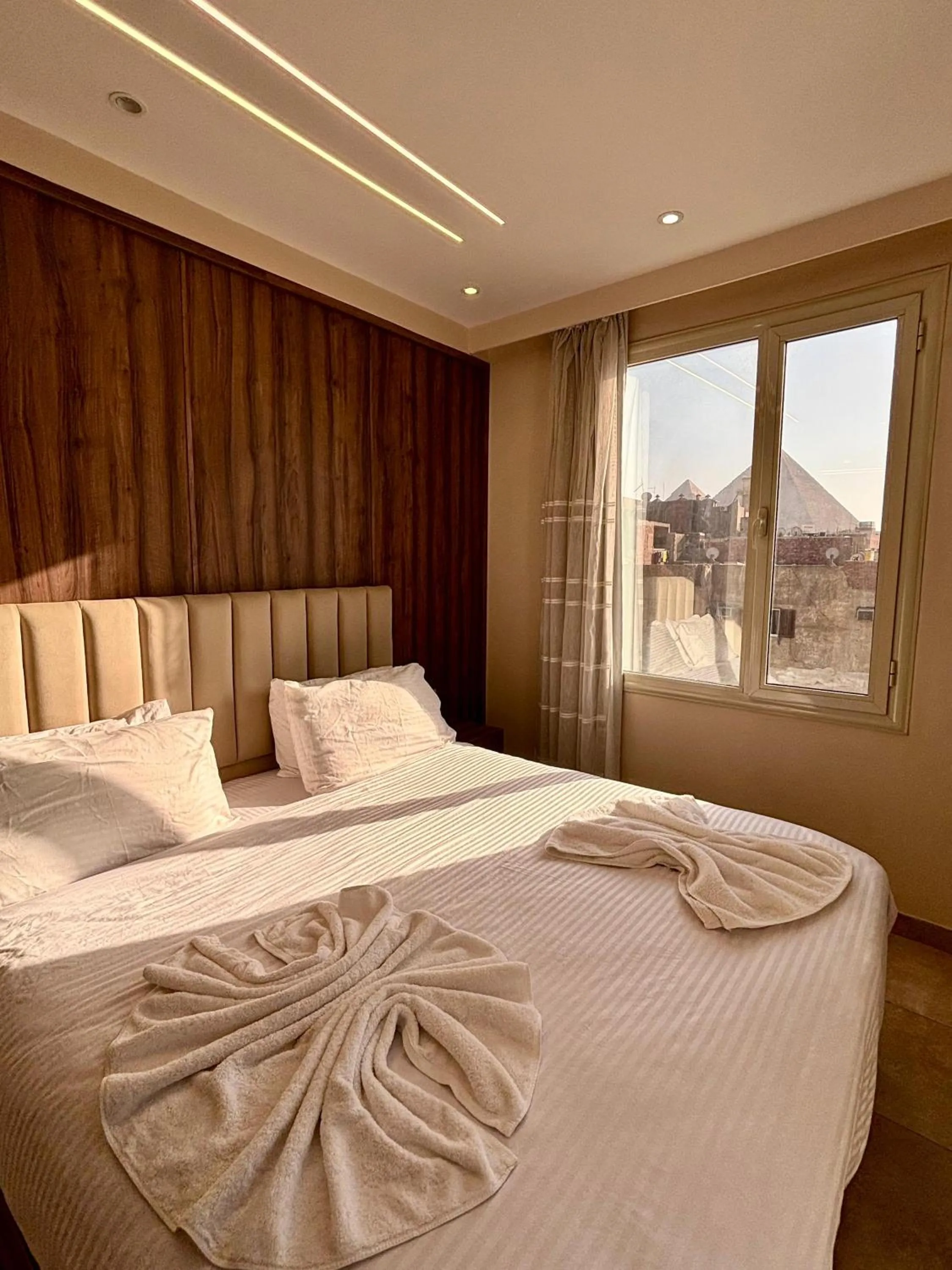 Bed in The Palace Pyramids View Hotel