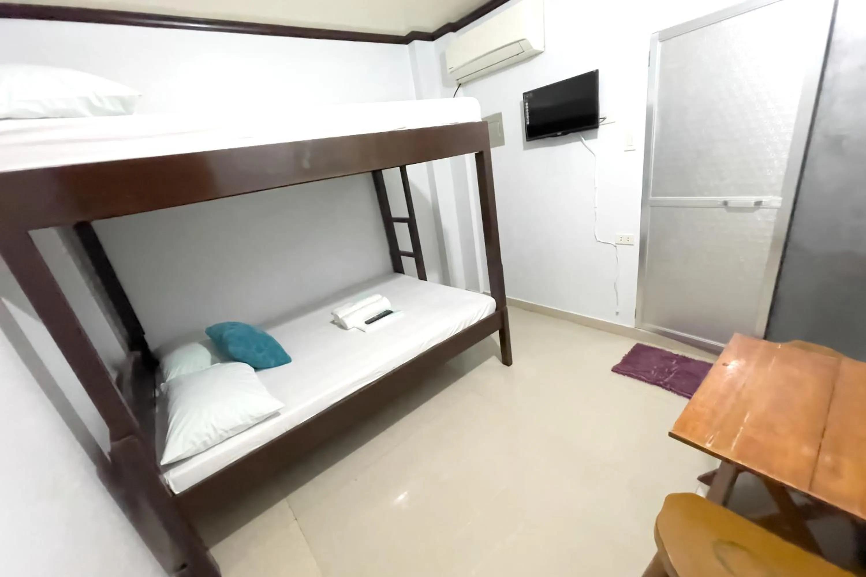 Bed in Catappa Lodge Puerto Galera