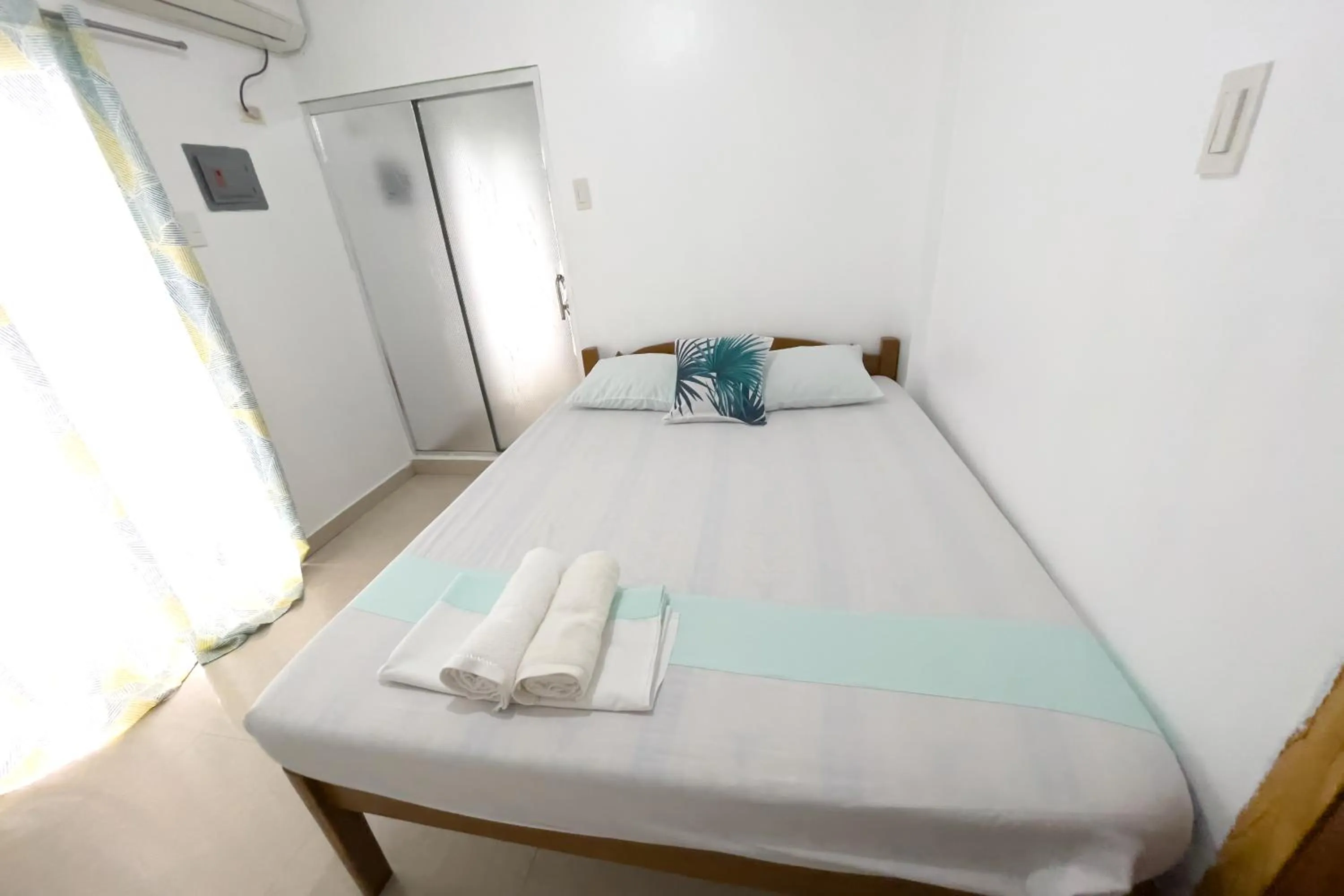 Bed in Catappa Lodge Puerto Galera