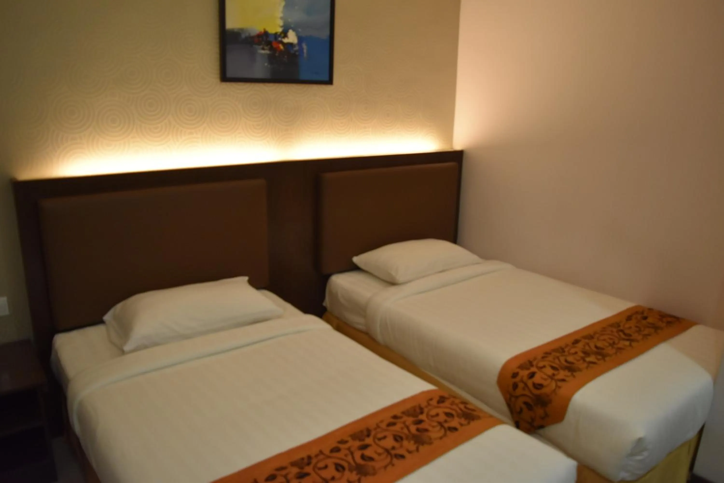 Bed in Sunrise Hotel