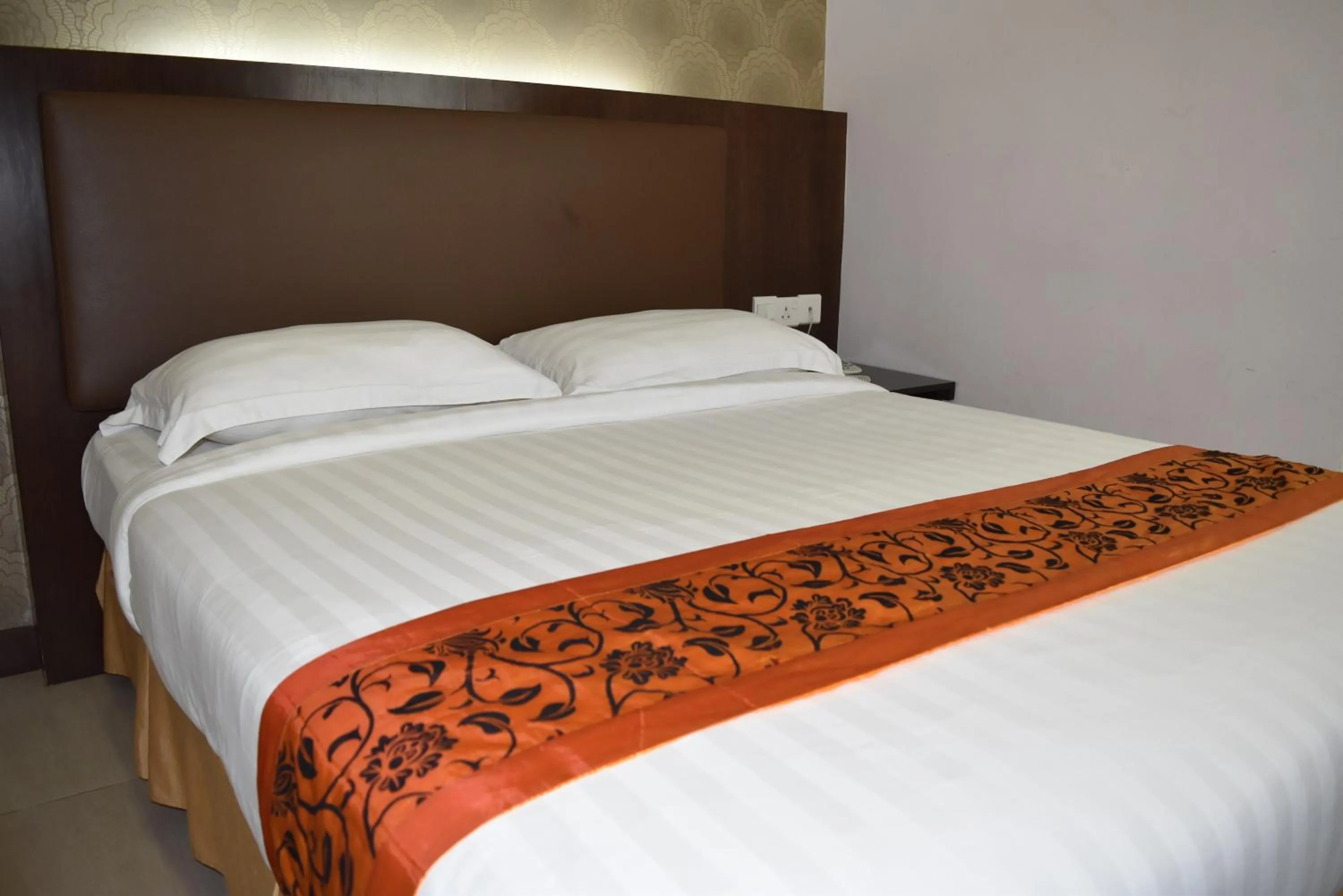 Bed in Sunrise Hotel