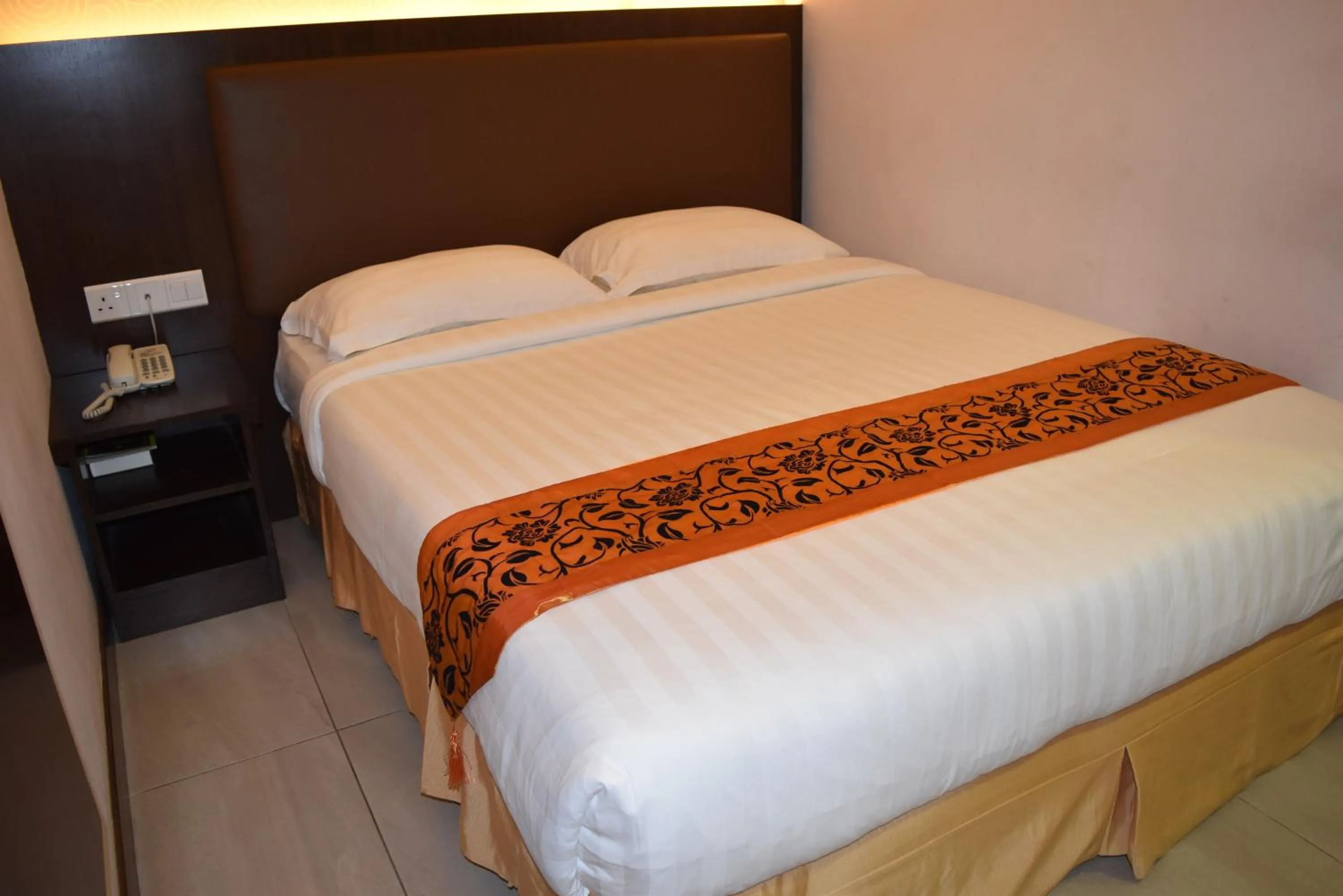 Bed in Sunrise Hotel