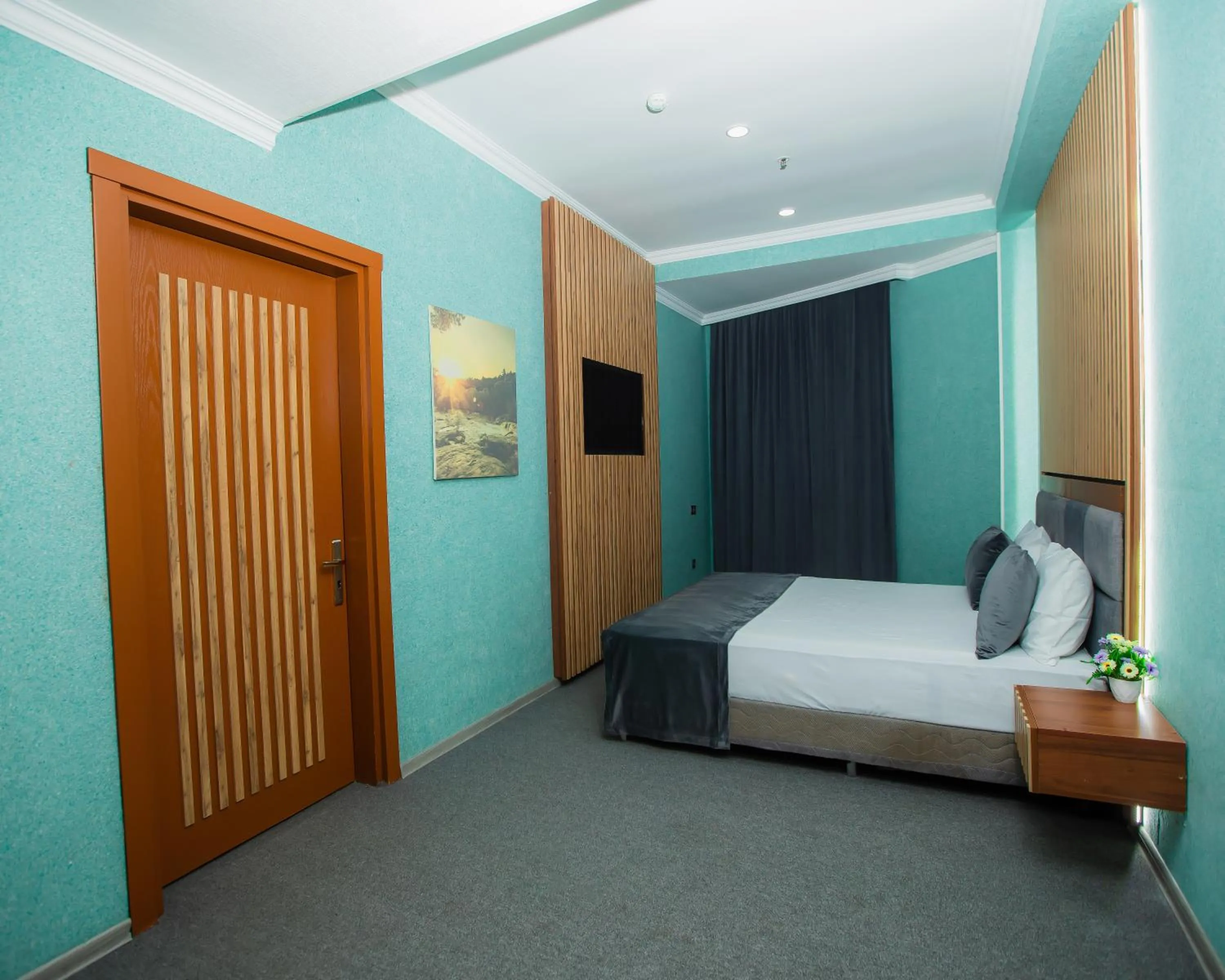 Bed in Corniche White City Hotel