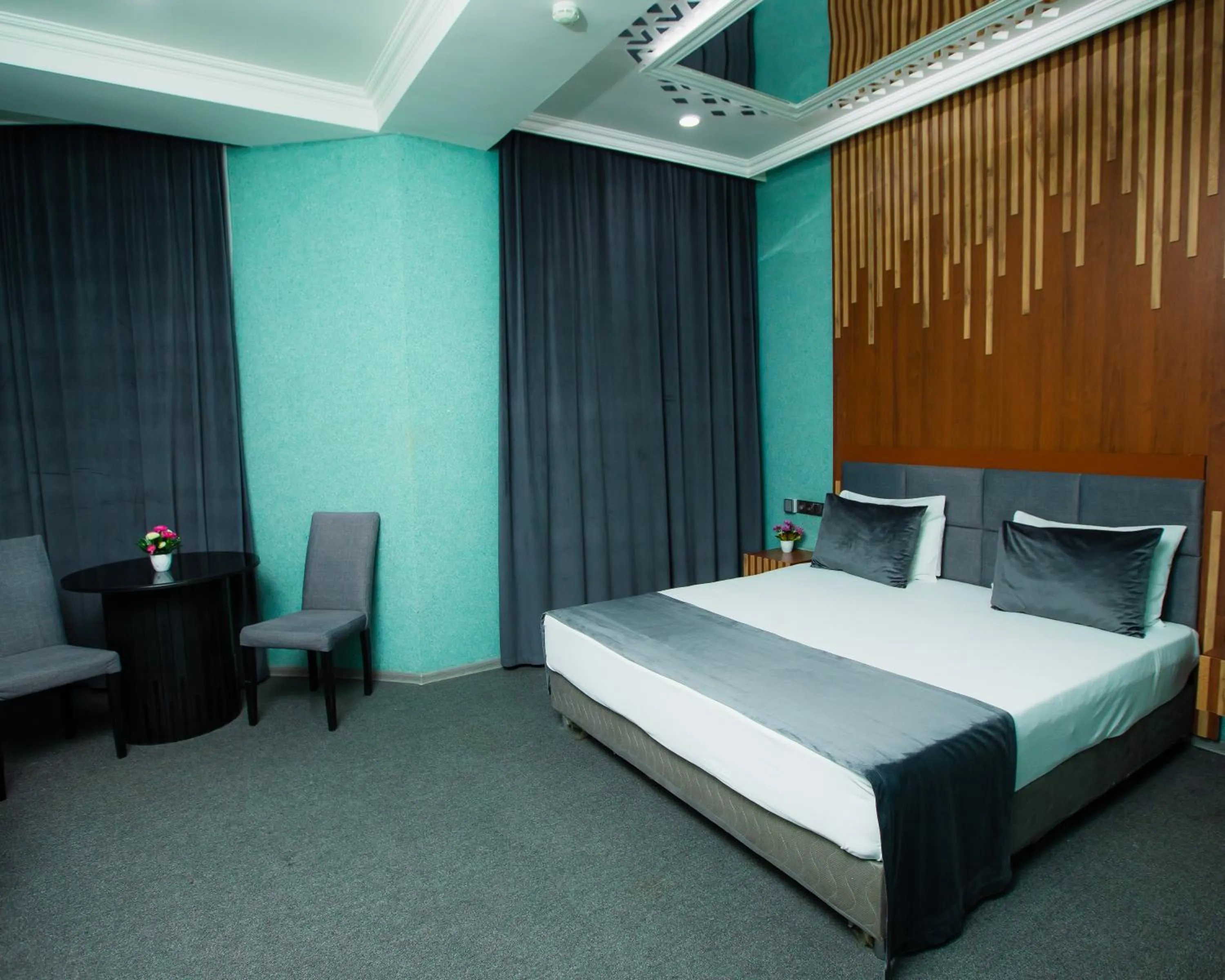 Bed in Corniche White City Hotel