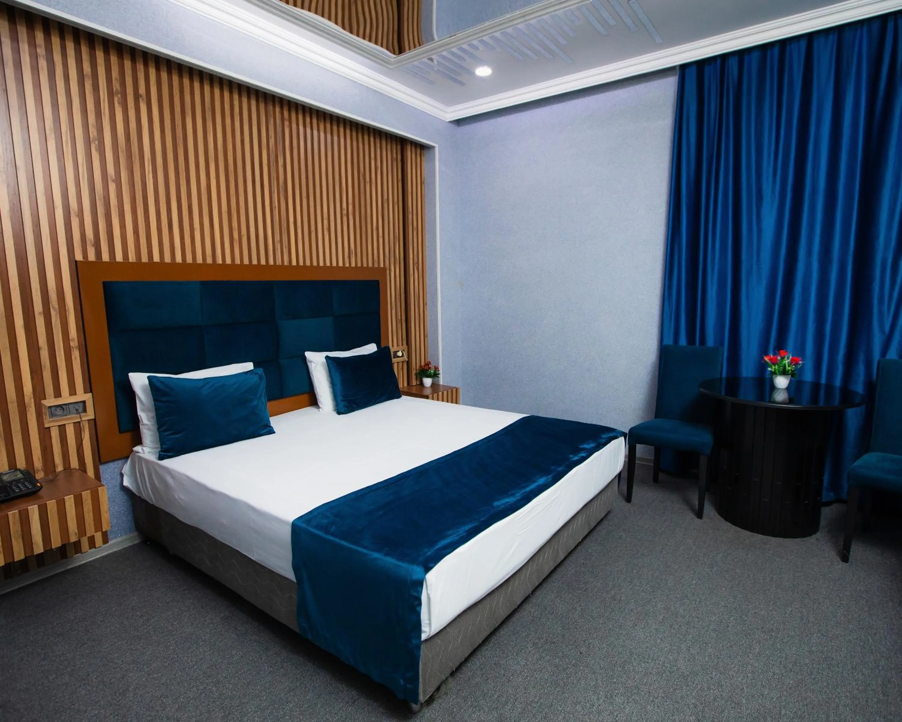 Bed in Corniche White City Hotel