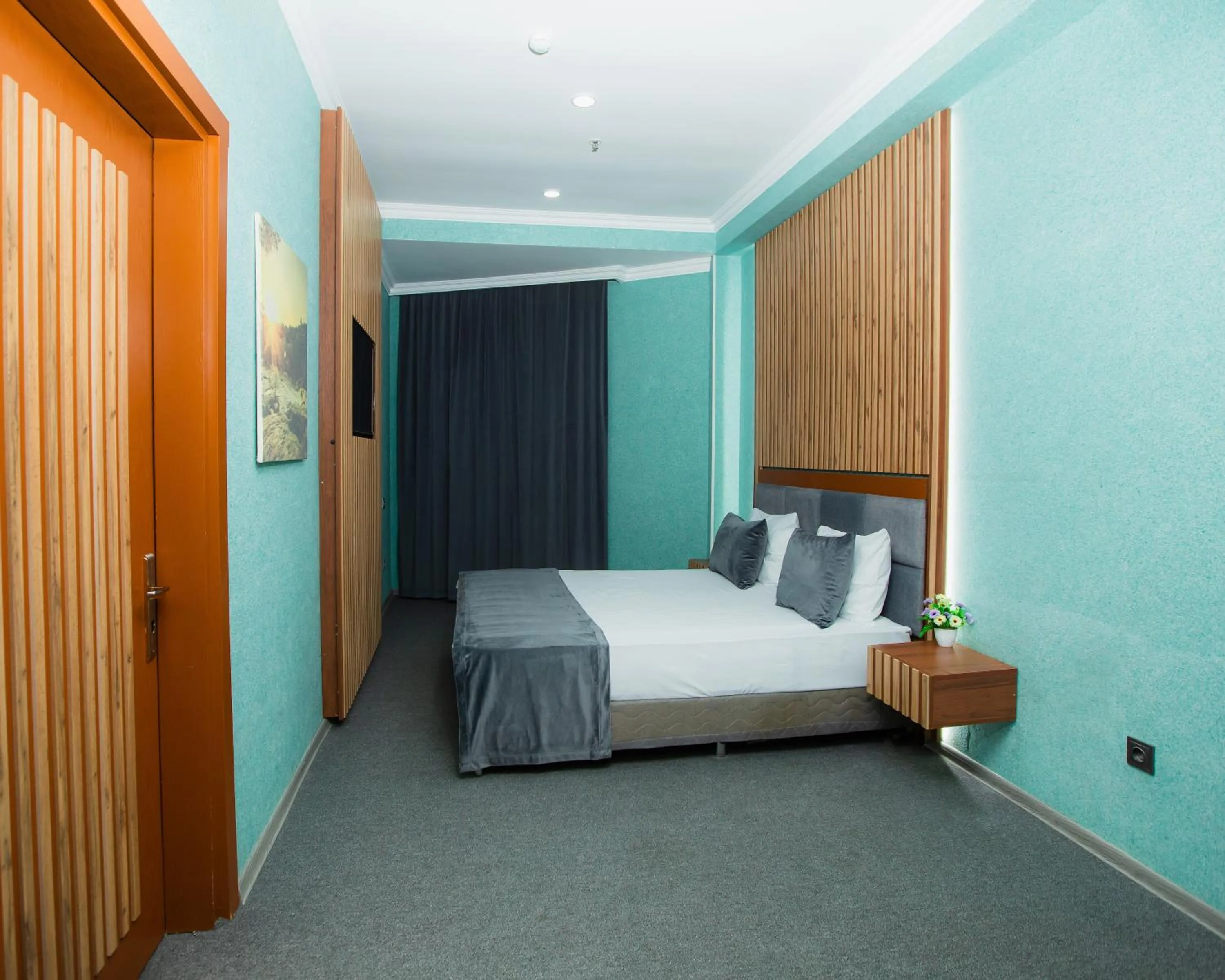 Bed in Corniche White City Hotel