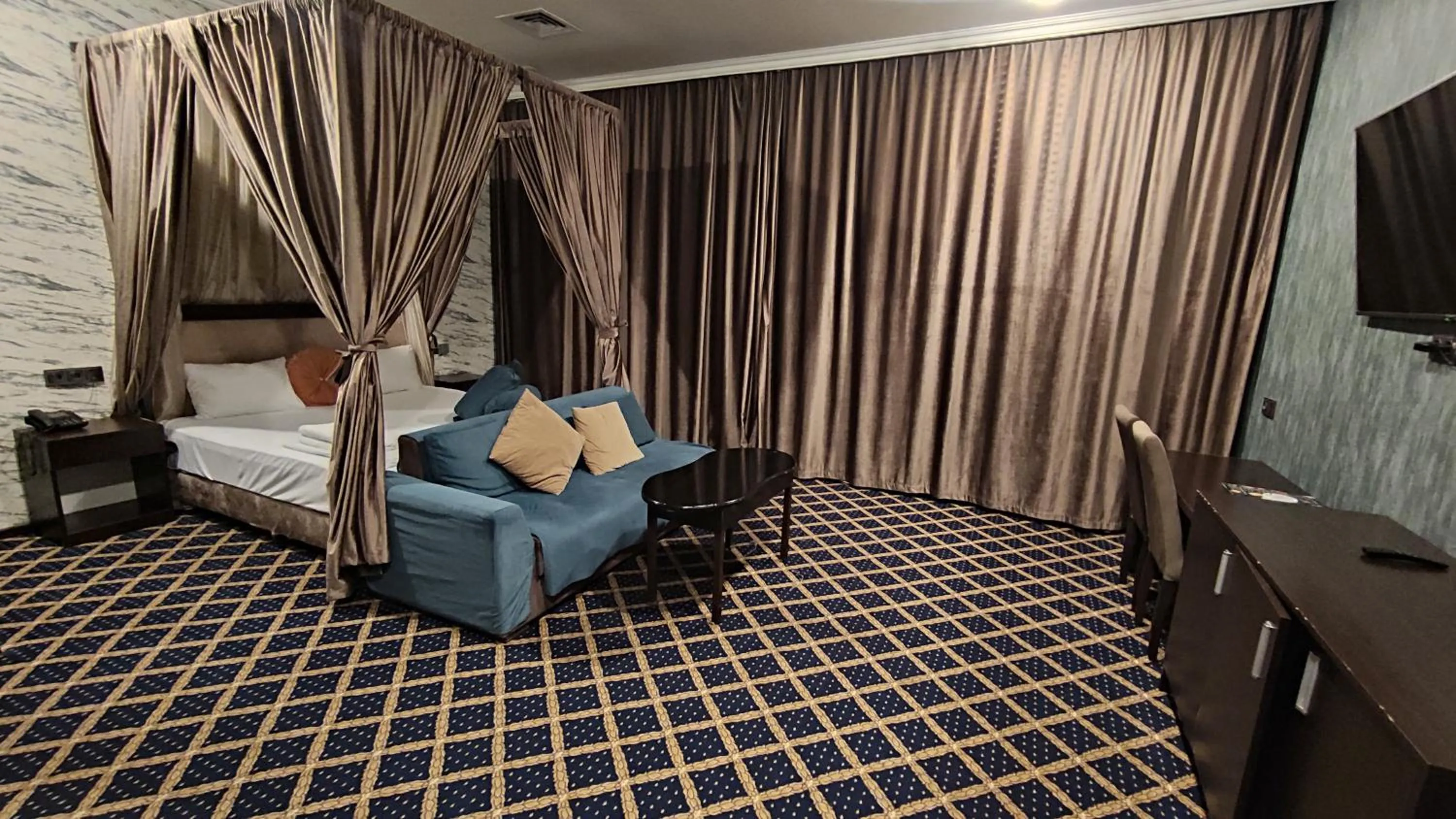 Bed in Corniche White City Hotel