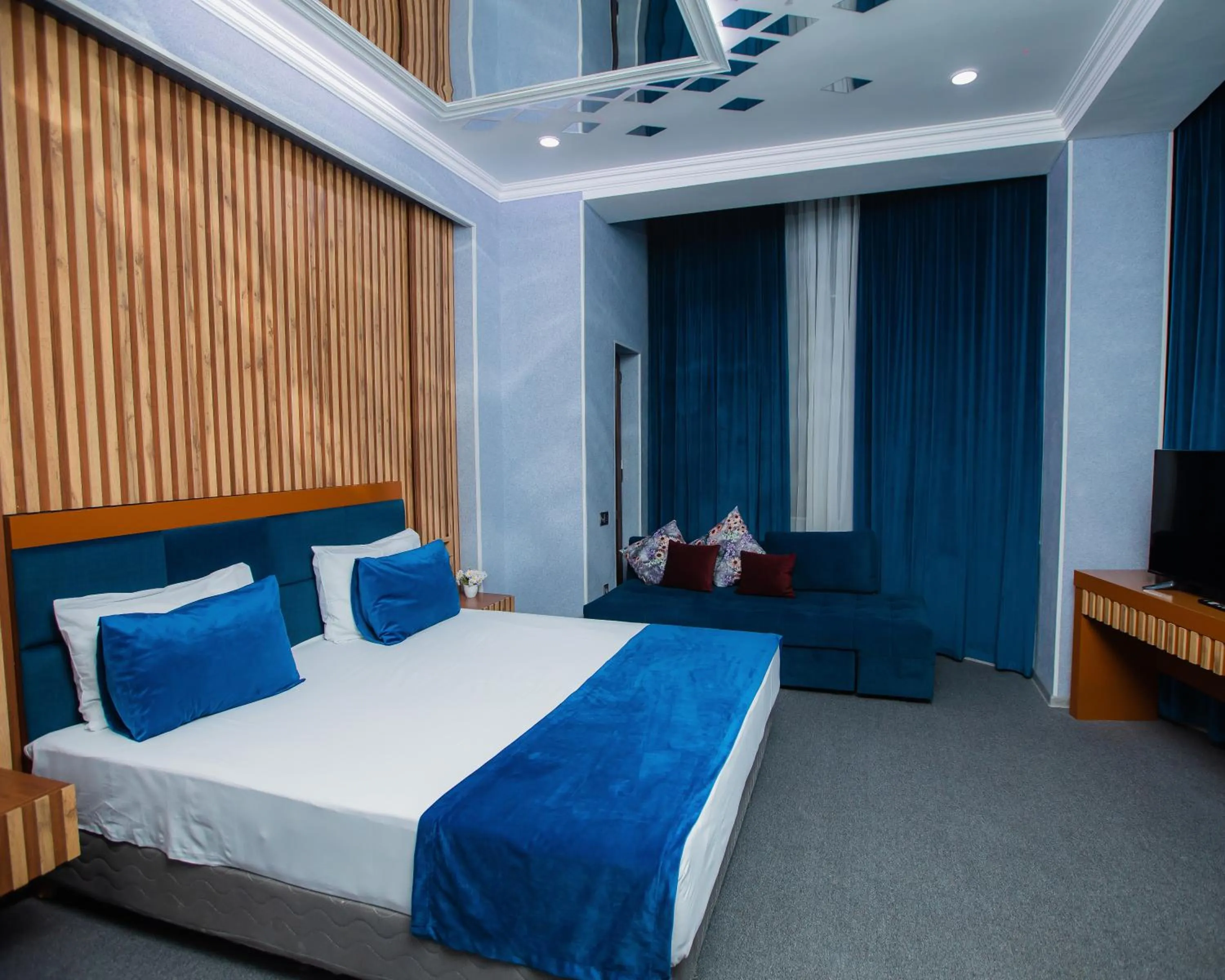 Bed in Corniche White City Hotel