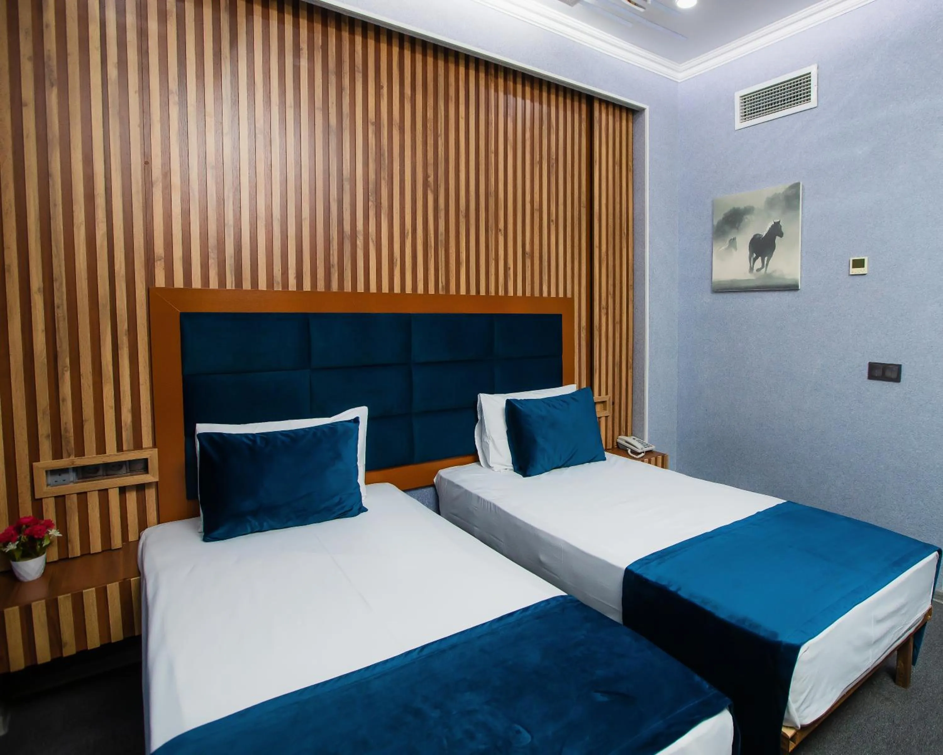 Bed in Corniche White City Hotel