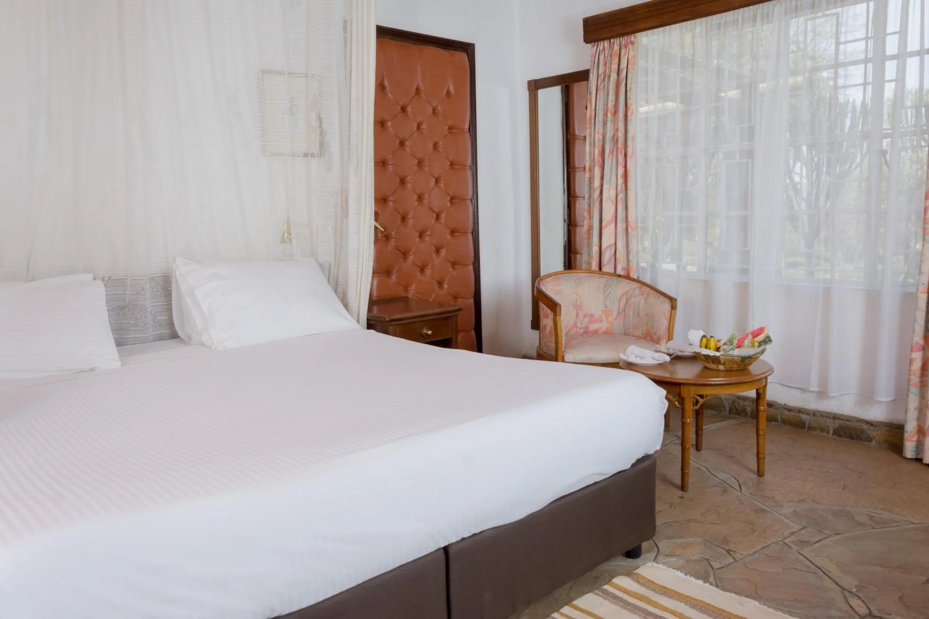 Bed in Jacaranda Lake Elementaita Lodge