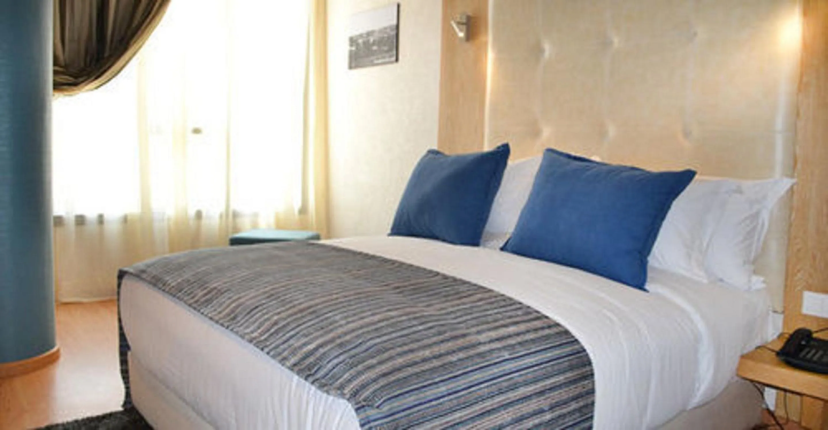 Bed in Le 135 appart hotel