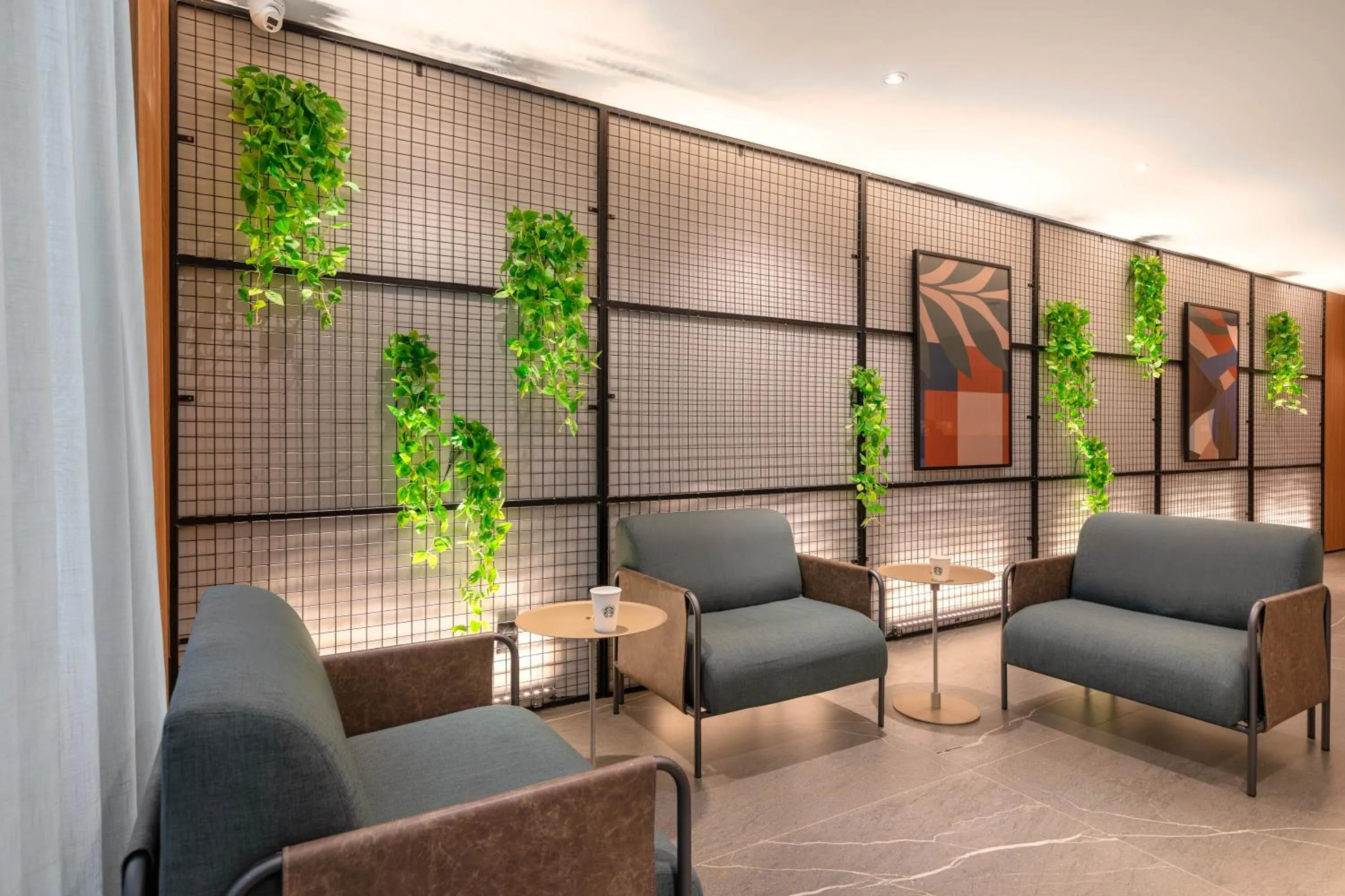 Communal lounge/ TV room in Cozzy Premium Paulista Hotel