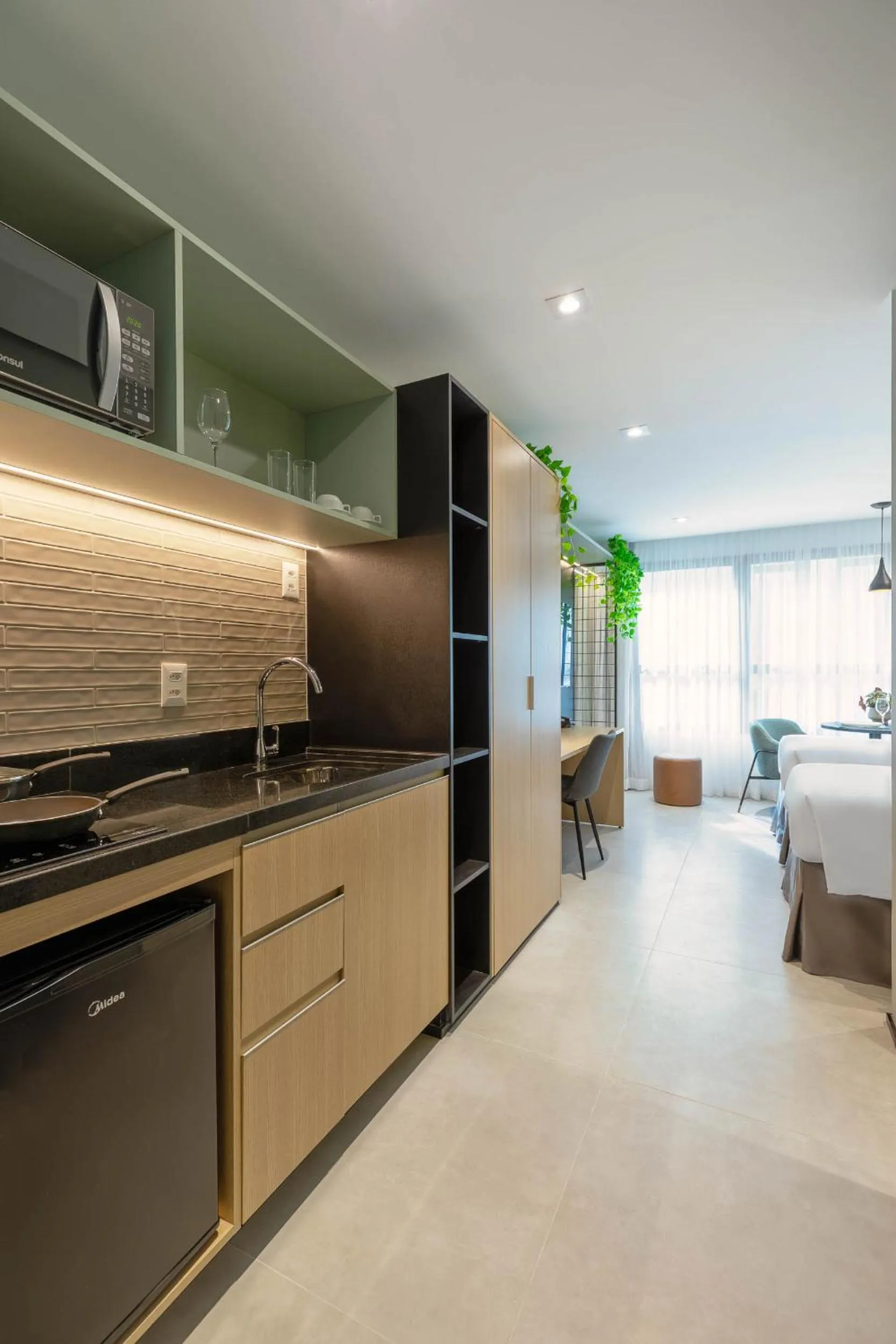 Kitchen or kitchenette in Cozzy Premium Paulista Hotel
