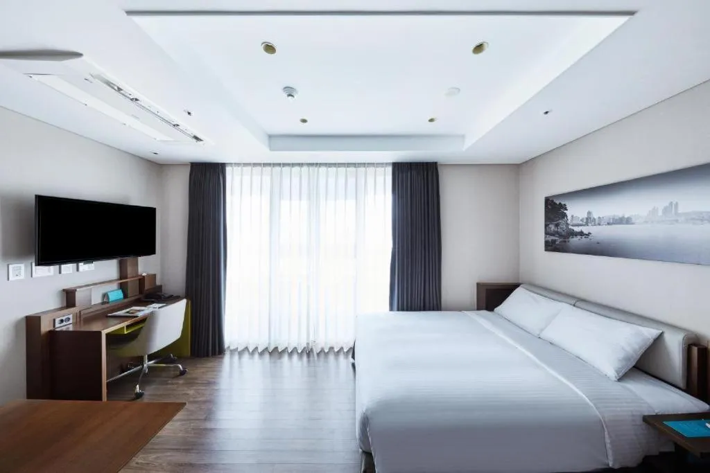 Bed in Felix by STX Hotel & Suite