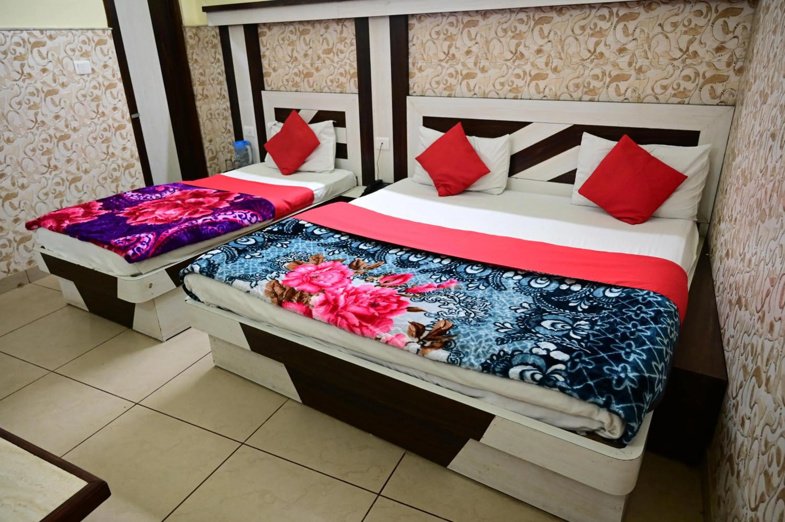 Bed in Hotel Vijay International