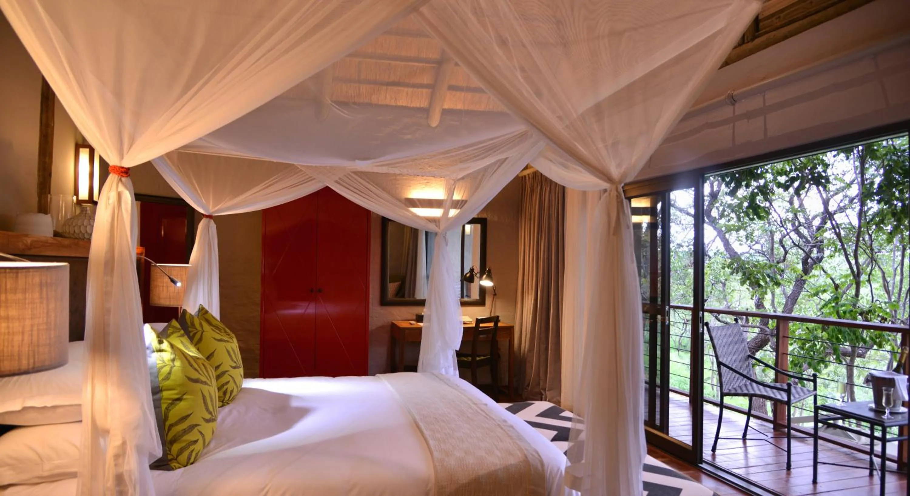 Photo of the whole room, Bed in Victoria Falls Safari Suites
