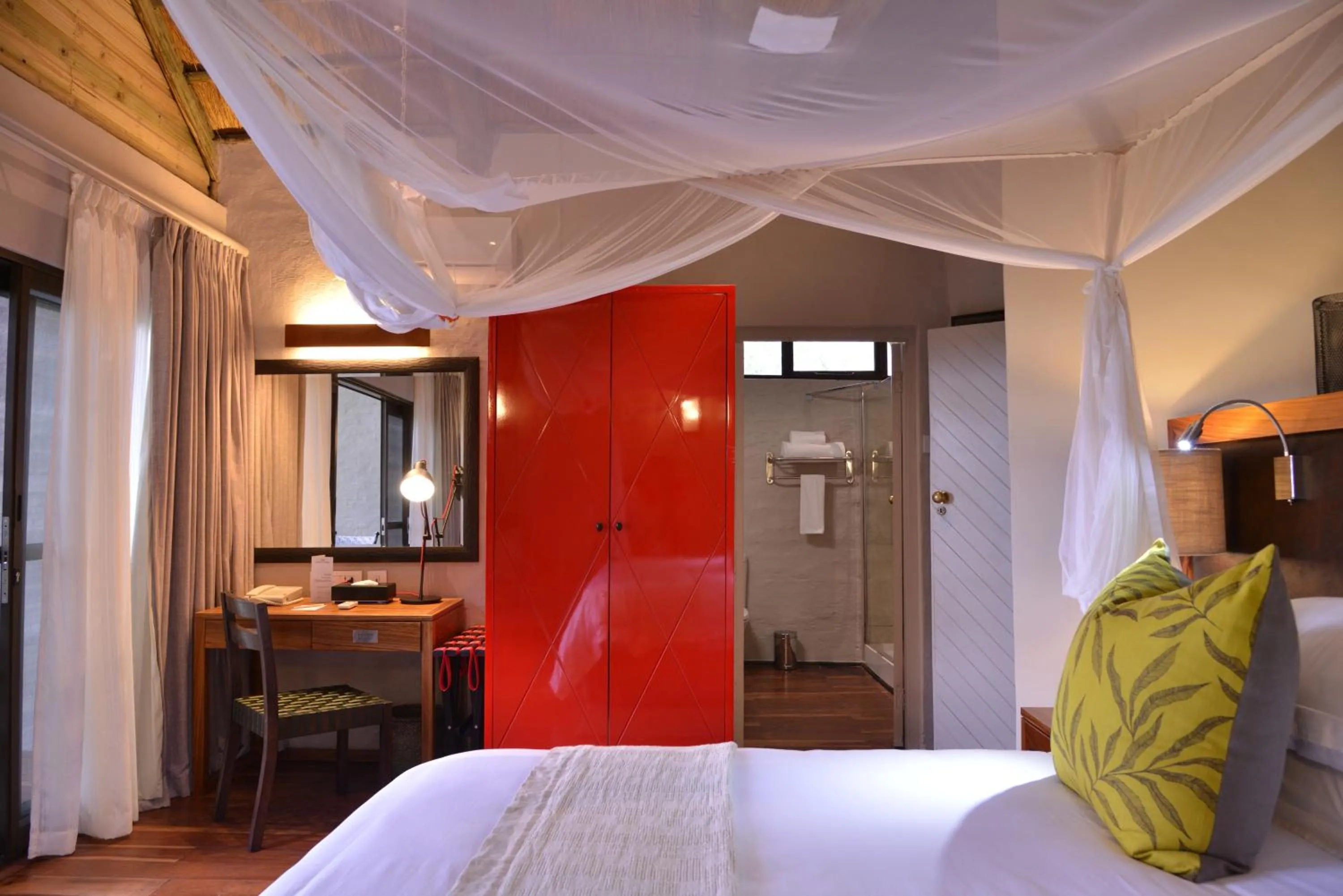 Photo of the whole room, Bed in Victoria Falls Safari Suites