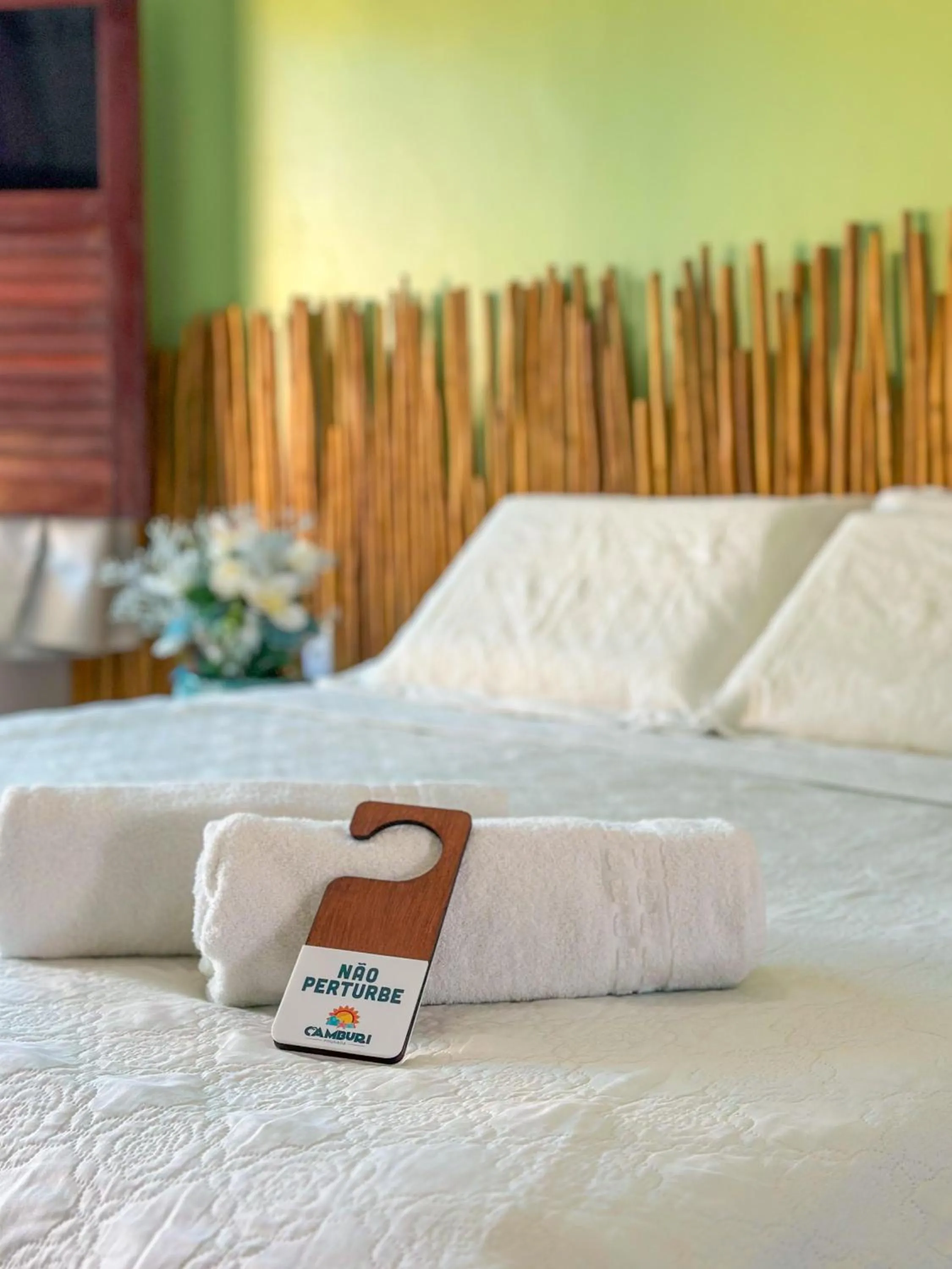 Bed in Pousada Camburi