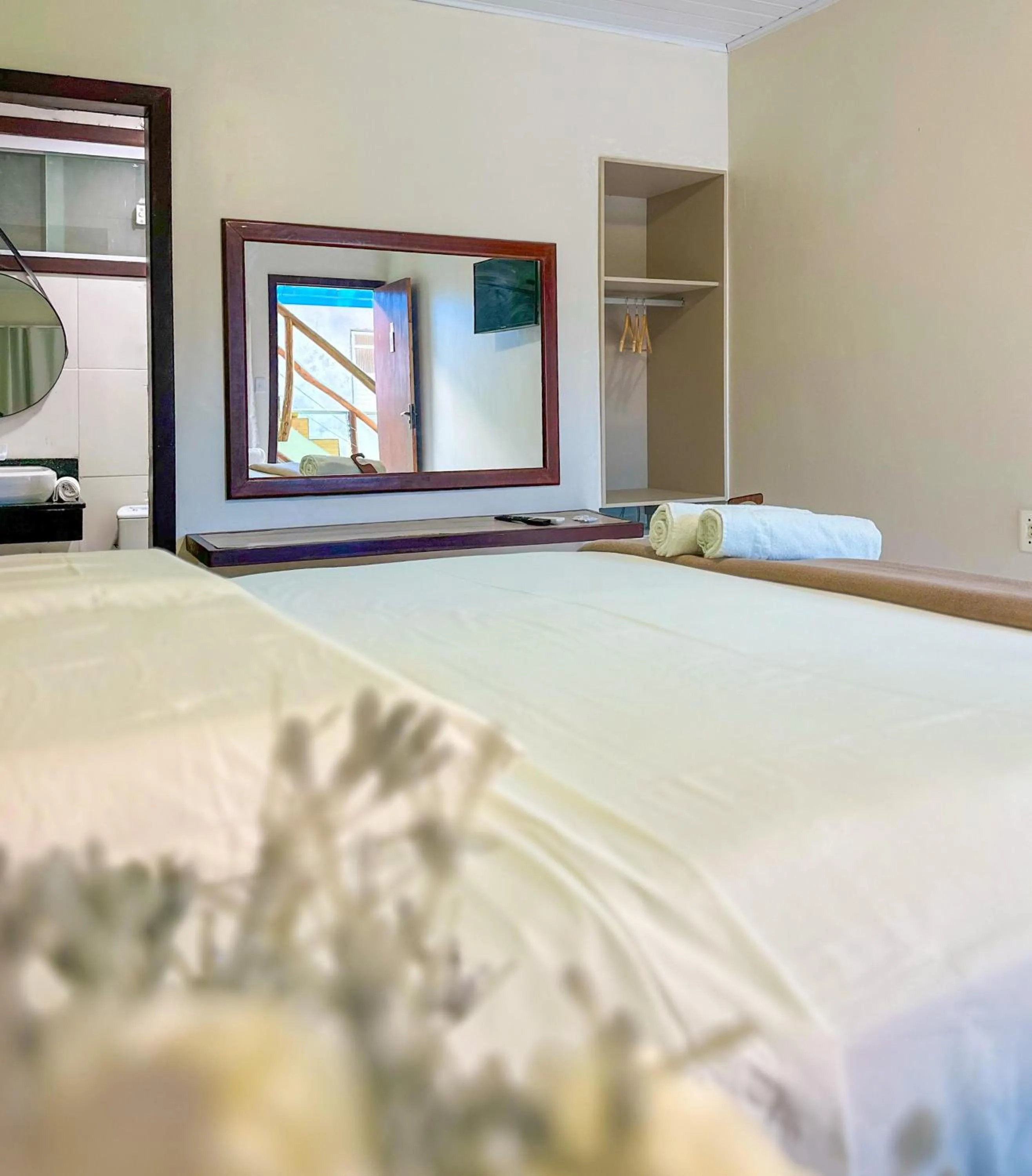 Bed in Pousada Camburi