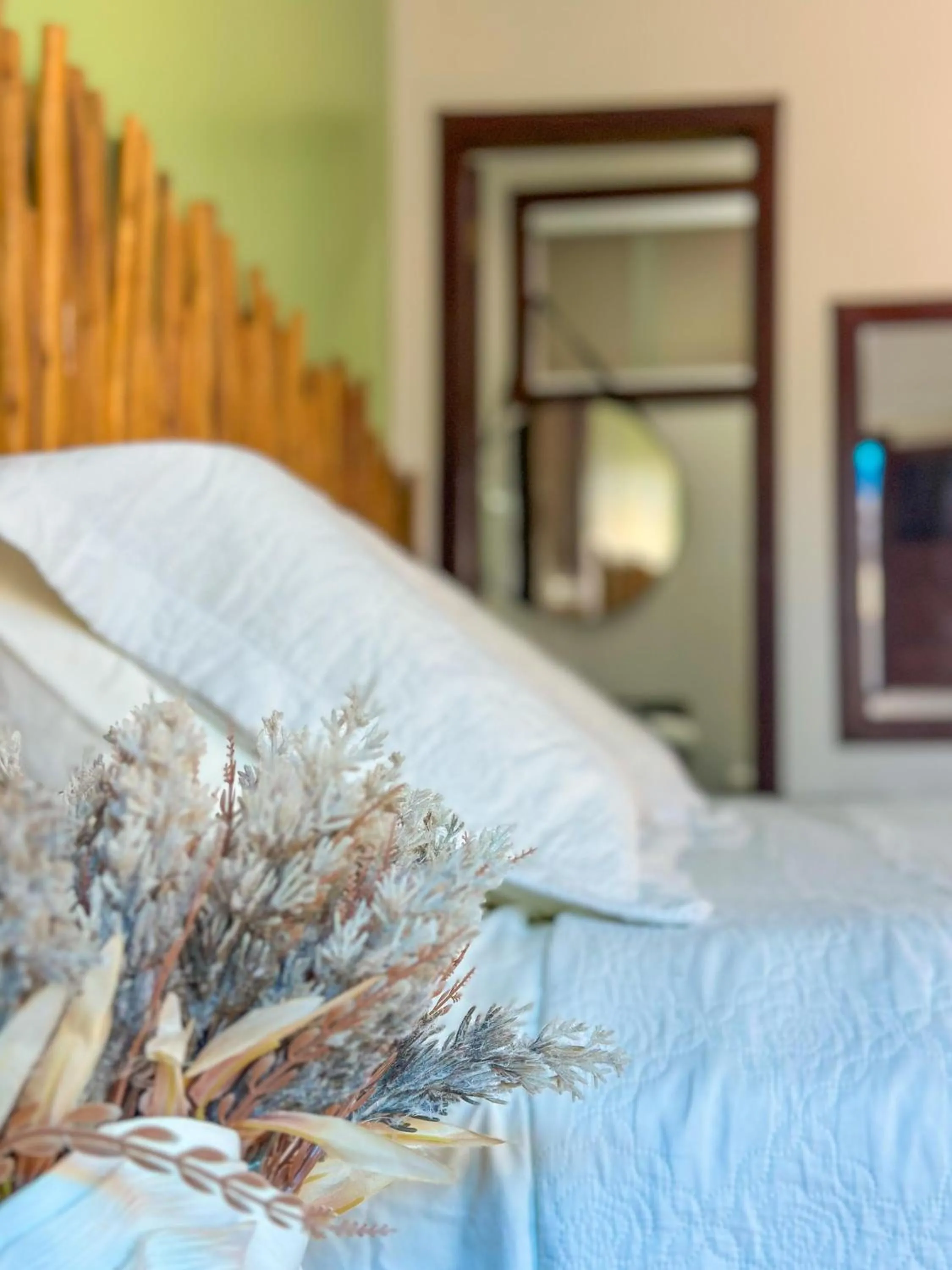 Bed in Pousada Camburi