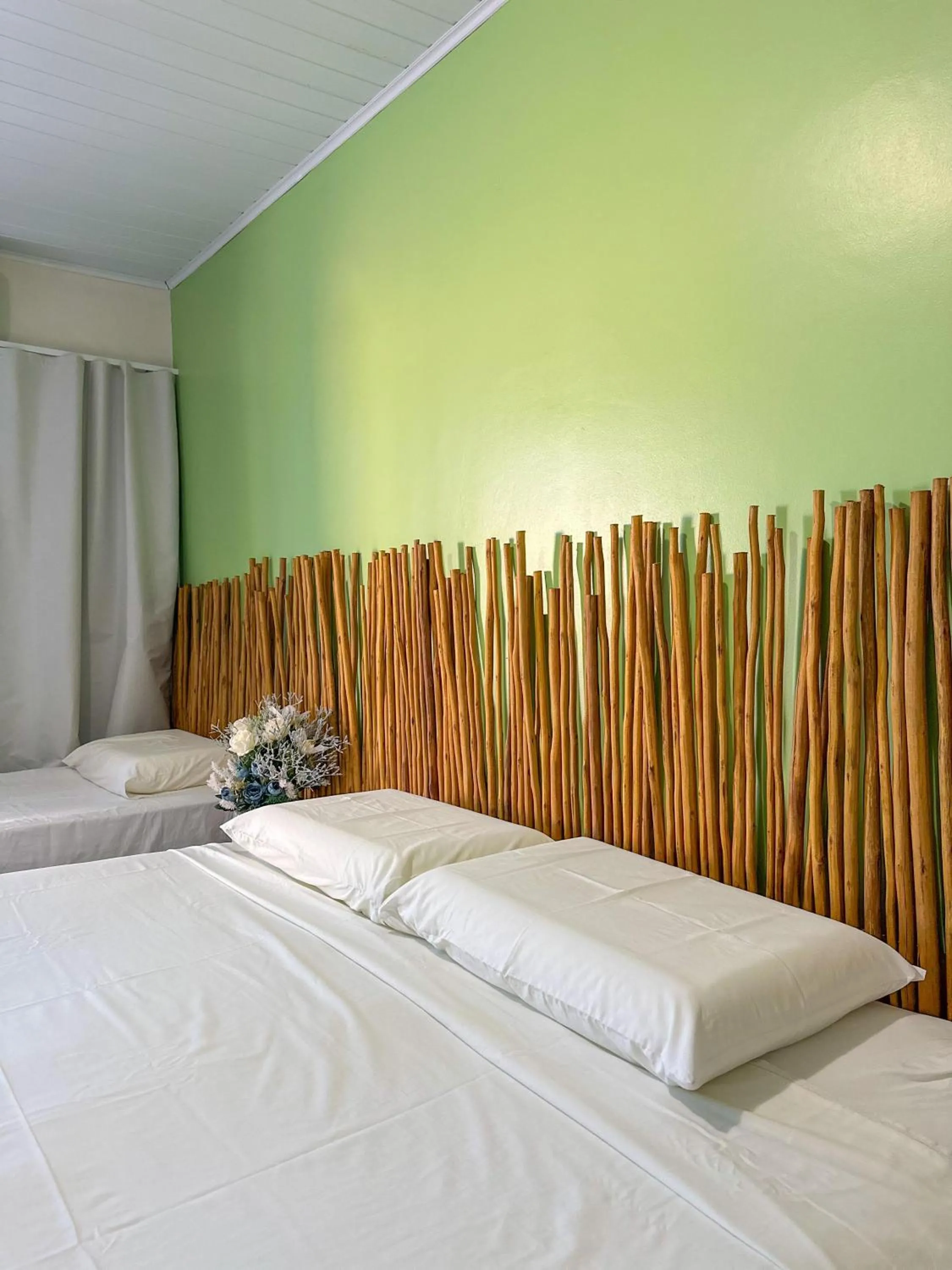 Bed in Pousada Camburi