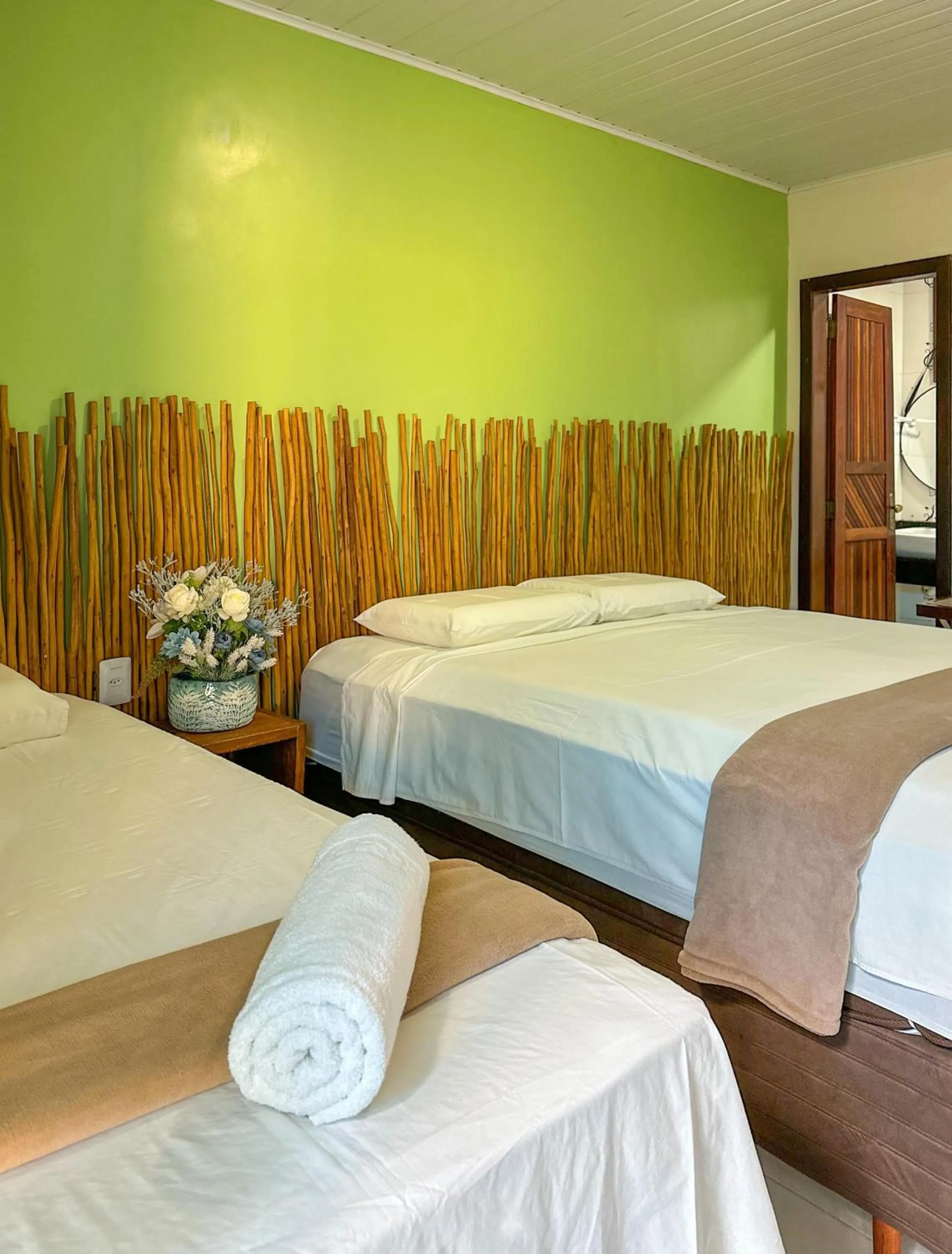 Bed in Pousada Camburi