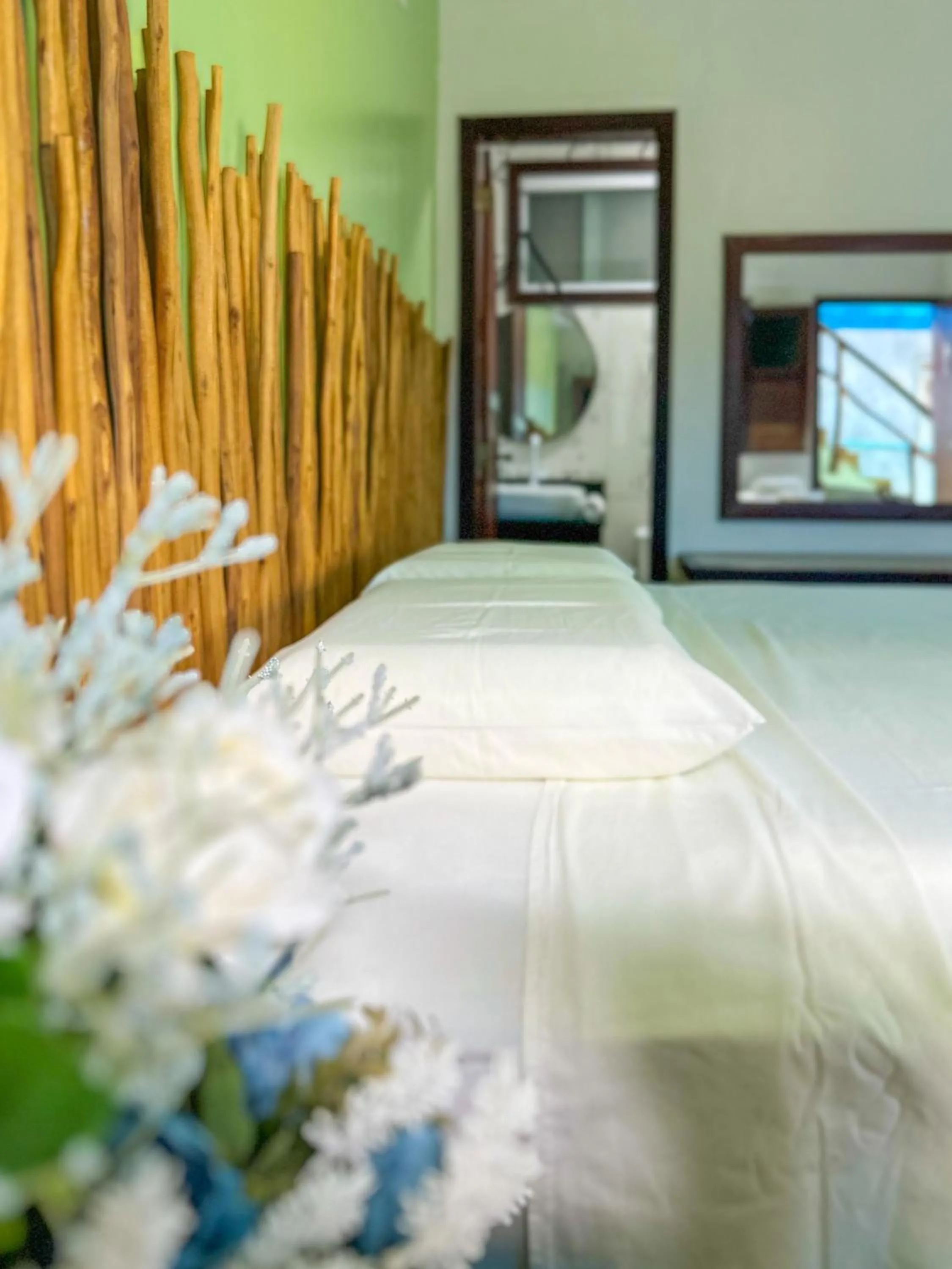 Bed in Pousada Camburi