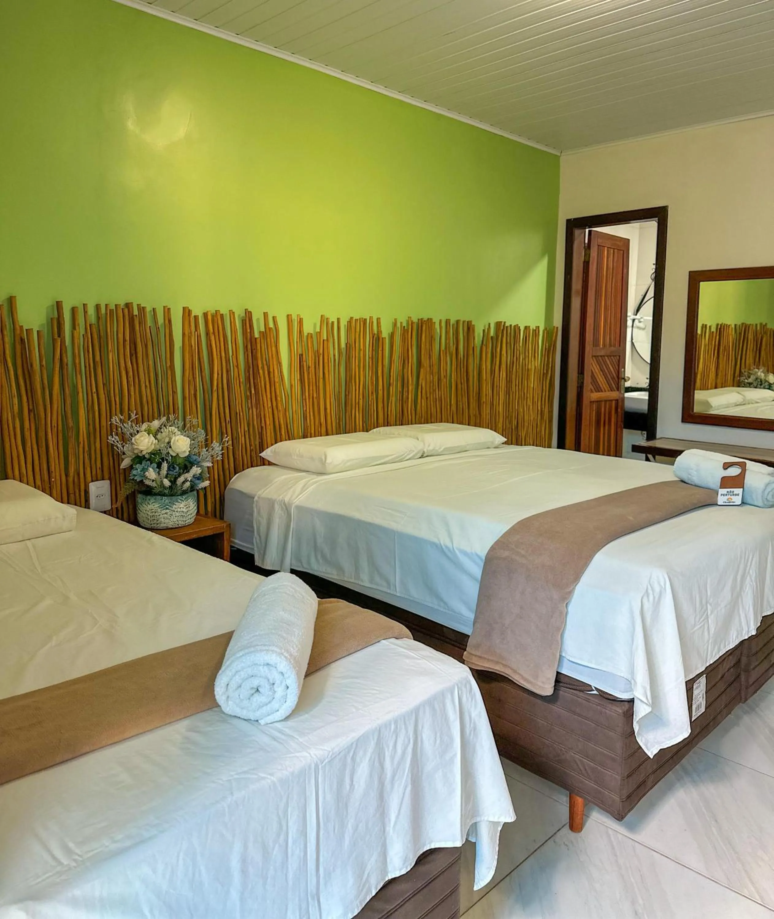 Bed in Pousada Camburi
