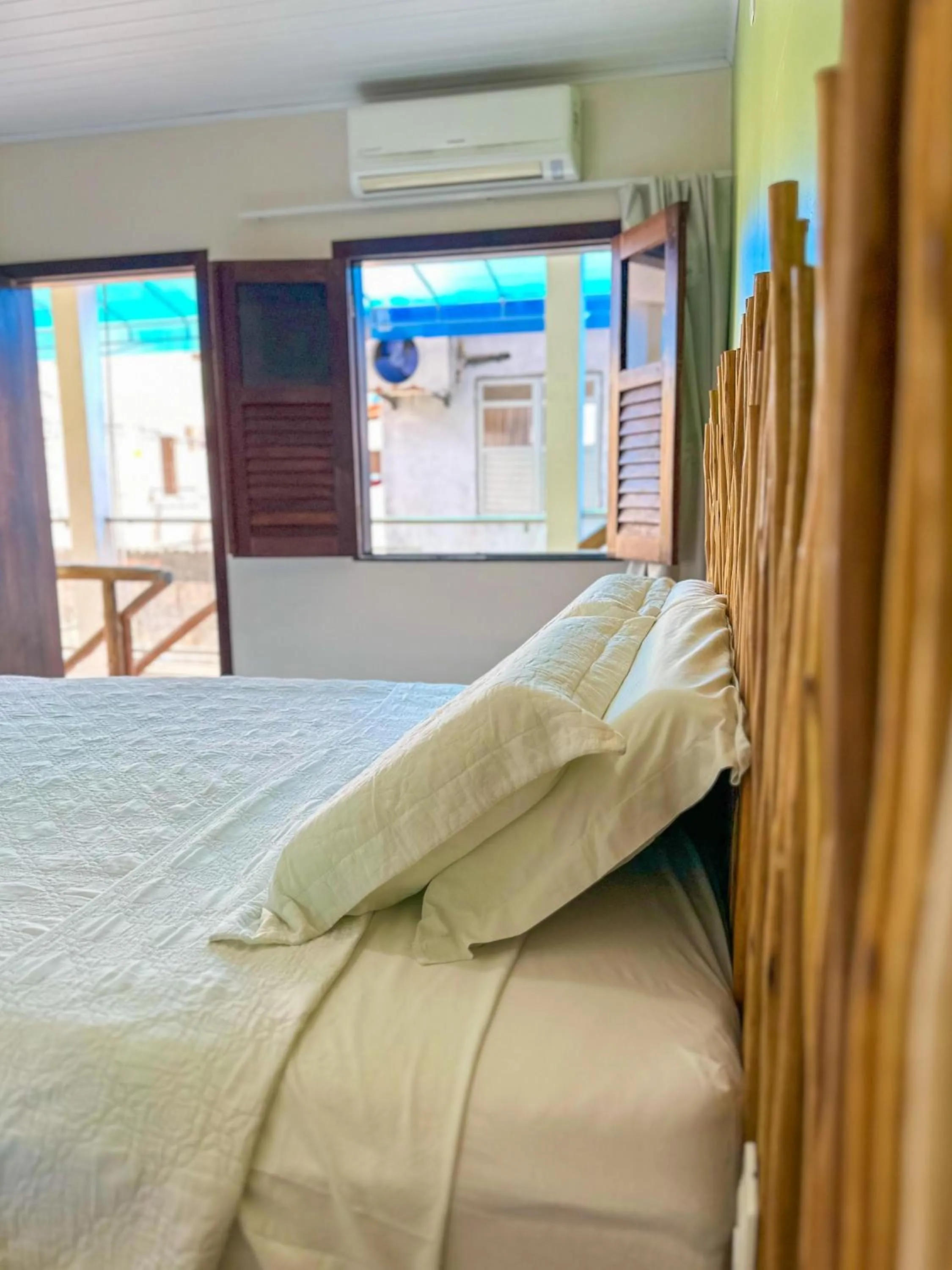 Bed in Pousada Camburi