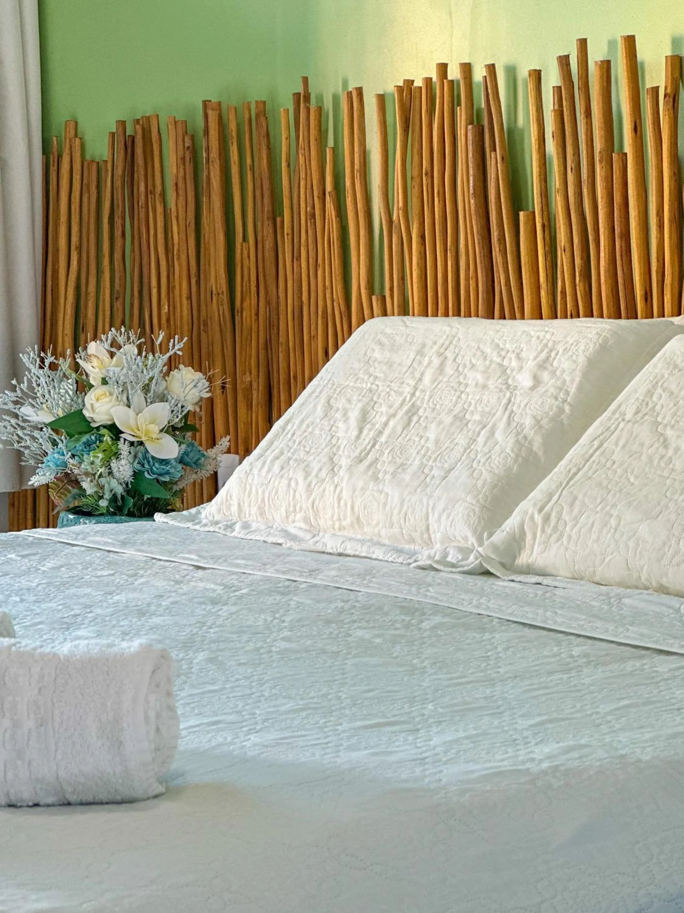 Bed in Pousada Camburi